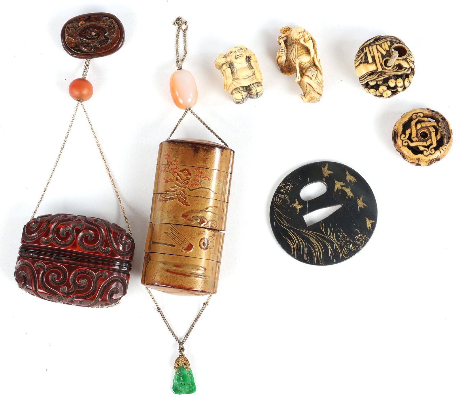 20TH C. JAPANESE COLLECIBLES LOT: 20TH C. JAPANESE COLLECIBLES LOT Japanese collectibles, circa 20th century. Includes: Red lacquered wood inro with scrolling pattern Gold tone wood inro with jade charm (2) Netsuke carved from b