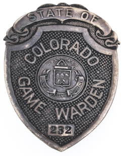 STERLING RESTRIKE OF COLORADO GAME WARDEN BADGE NO. 232: STERLING RESTRIKE OF COLORADO GAME WARDEN BADGE NO. 232 Obsolete post-production restrike of State of Colorado Game Warden badge. Number 232. Marked Sachs & Lawlor Denver and Sterling on reverse. 