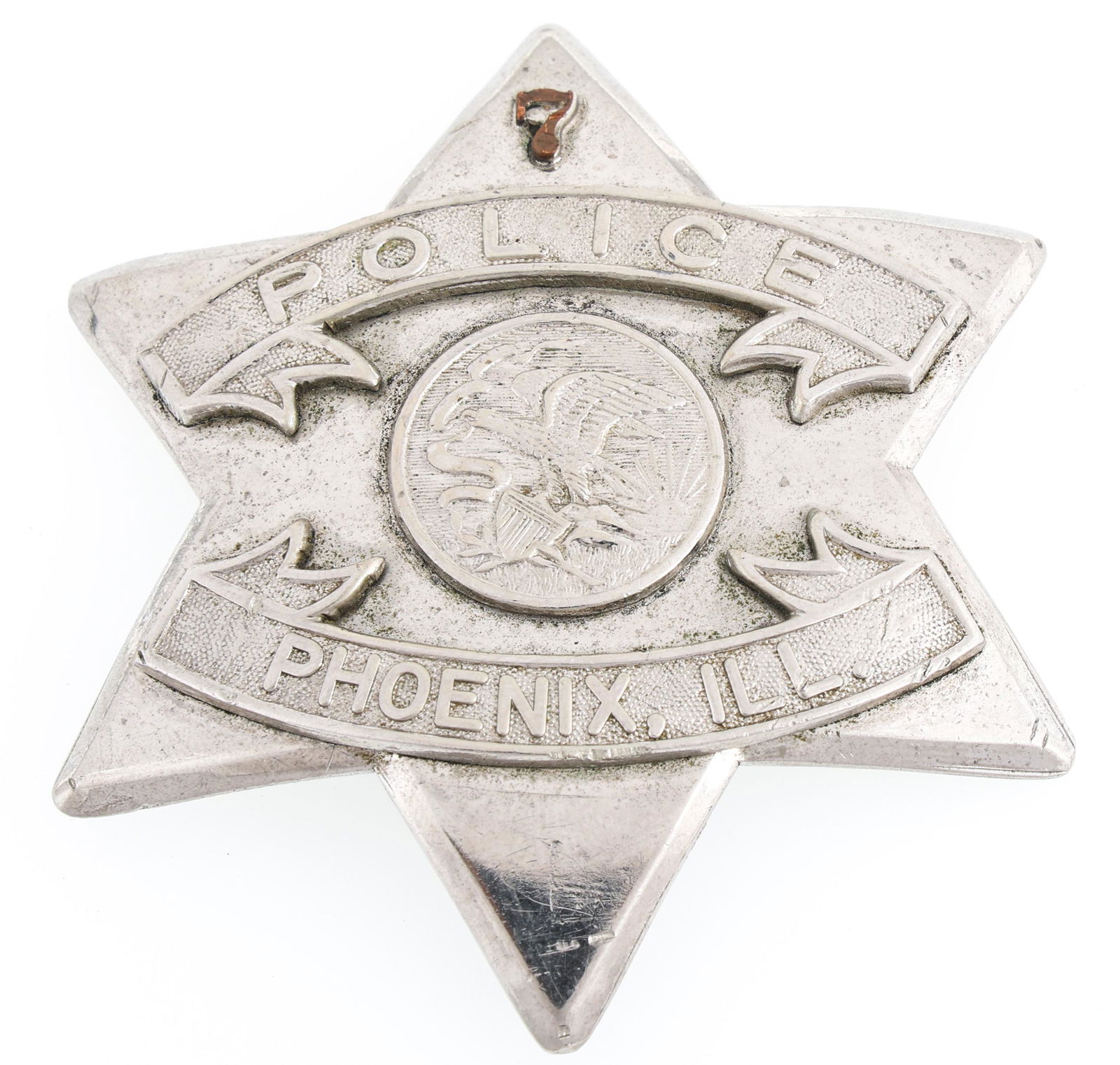 PHOENIX ILLINOIS POLICE PIE PLATE BADGE NO. 7: PHOENIX ILLINOIS POLICE PIE PLATE BADGE NO. 7 Obsolete Phoenix, Illinois Police pie plate badge. Number 7. Marked The C.H. Hanson Company Chicago on back. Measurements: 3 x 3"