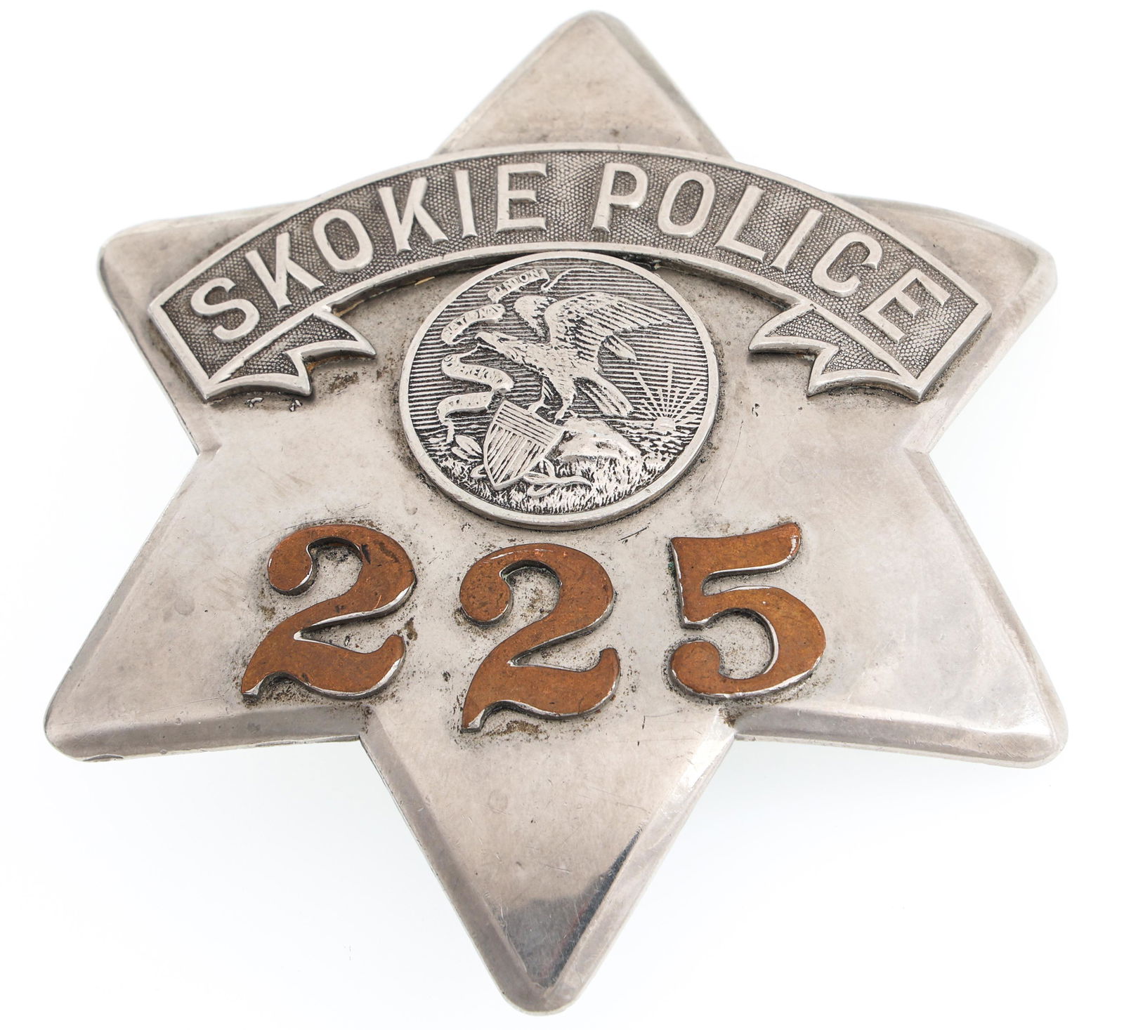 SKOKIE ILLINOIS POLICE PIE PLATE BADGE NO. 225: SKOKIE ILLINOIS POLICE PIE PLATE BADGE NO. 225 Obsolete Skokie, Illinois Police pie plate badge. Number 225. Marked C.H. Hanson & Co. Chicago on reverse. Measurements: 3 x 3.5"
