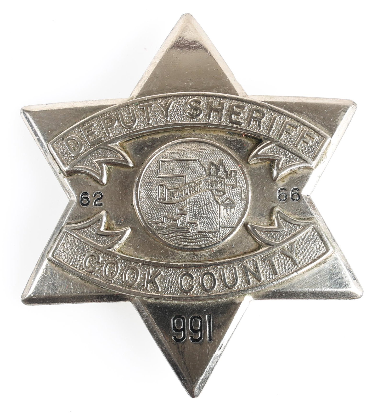 COOK COUNTY ILLINOIS DEPUTY SHERIFF PIE PLATE BADGE: COOK COUNTY ILLINOIS DEPUTY SHERIFF PIE PLATE BADGE Obsolete Cook County, Illinois Deputy Sheriff pie plate badge. Number 991. Marked The C.H. Hanson Company Chicago on back. Mea