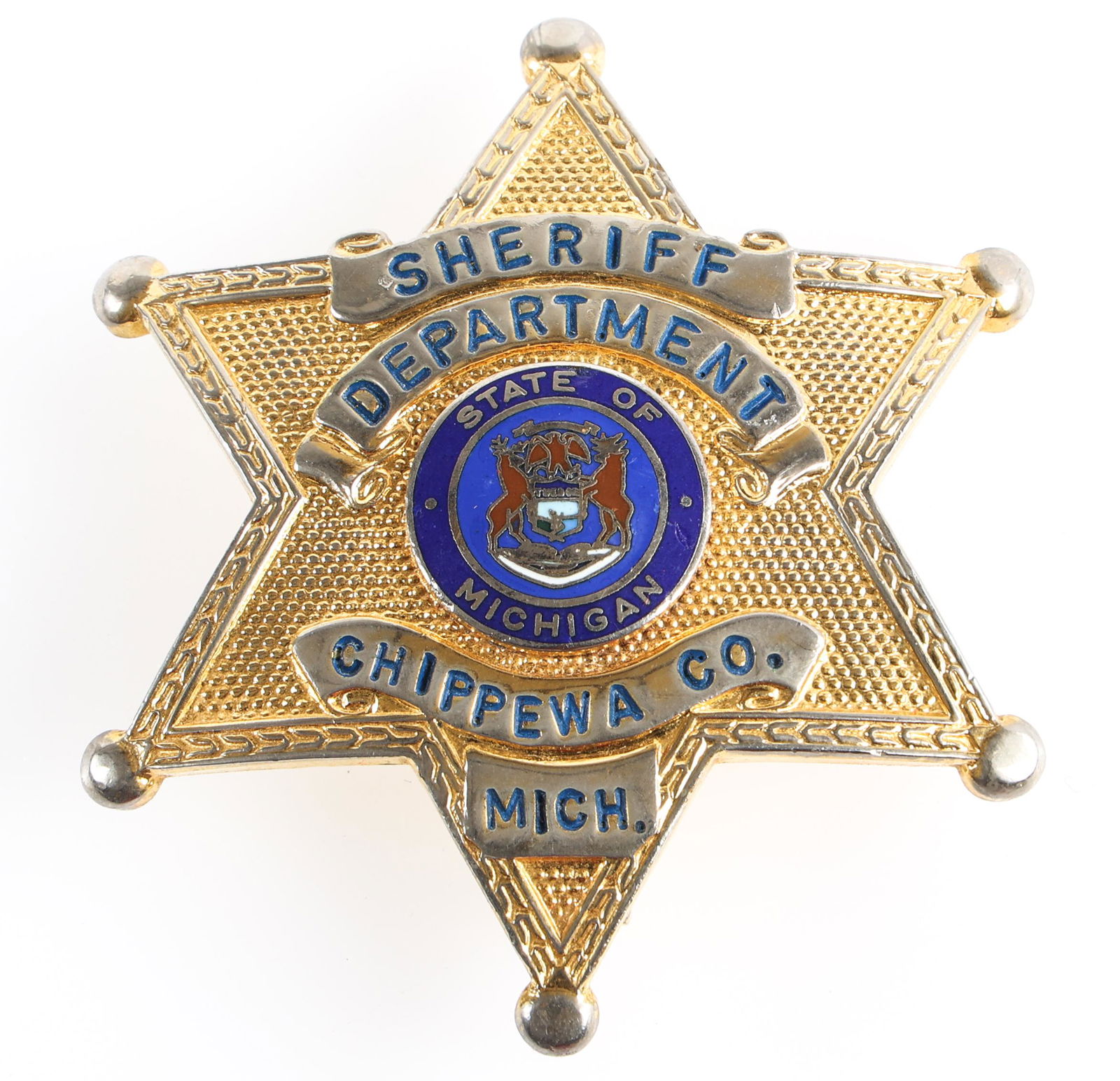 CHIPPEWA COUNTY MICHIGAN SHERIFF DEPARTMENT BADGE: CHIPPEWA COUNTY MICHIGAN SHERIFF DEPARTMENT BADGE Obsolete Chippewa County, Michigan Sheriff Department badge. Unmarked. Measurements: 2.25 x 2.75"