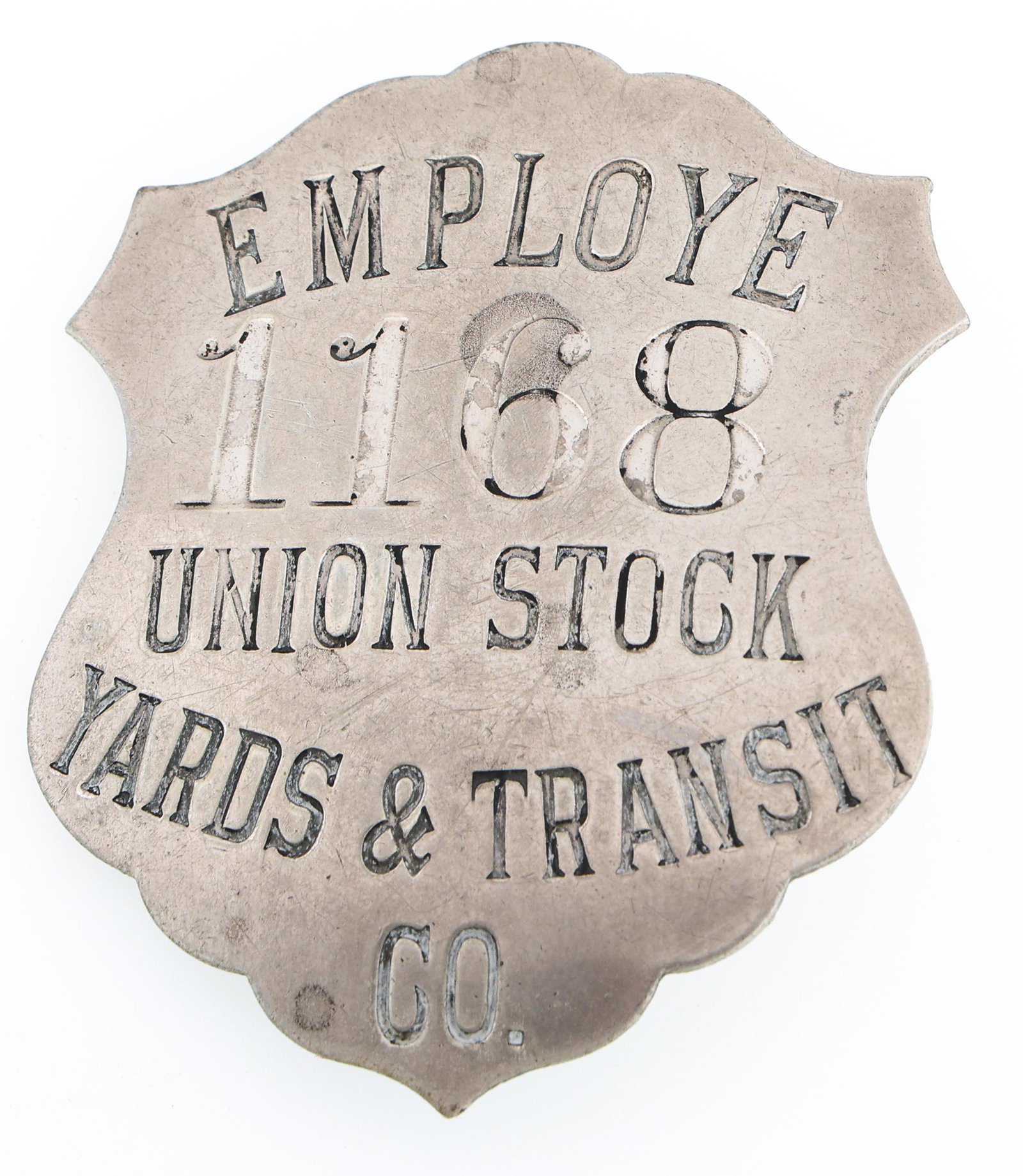 UNION STOCK YARDS & TRANSIT CO. EMPLOYEE BADGE NO. 1168: UNION STOCK YARDS & TRANSIT CO. EMPLOYEE BADGE NO. 1168 Obsolete Union Stock Yards & Transit Co. Employee badge. Number 1168. Unmarked. Measurements: 2.25 x 2.75"