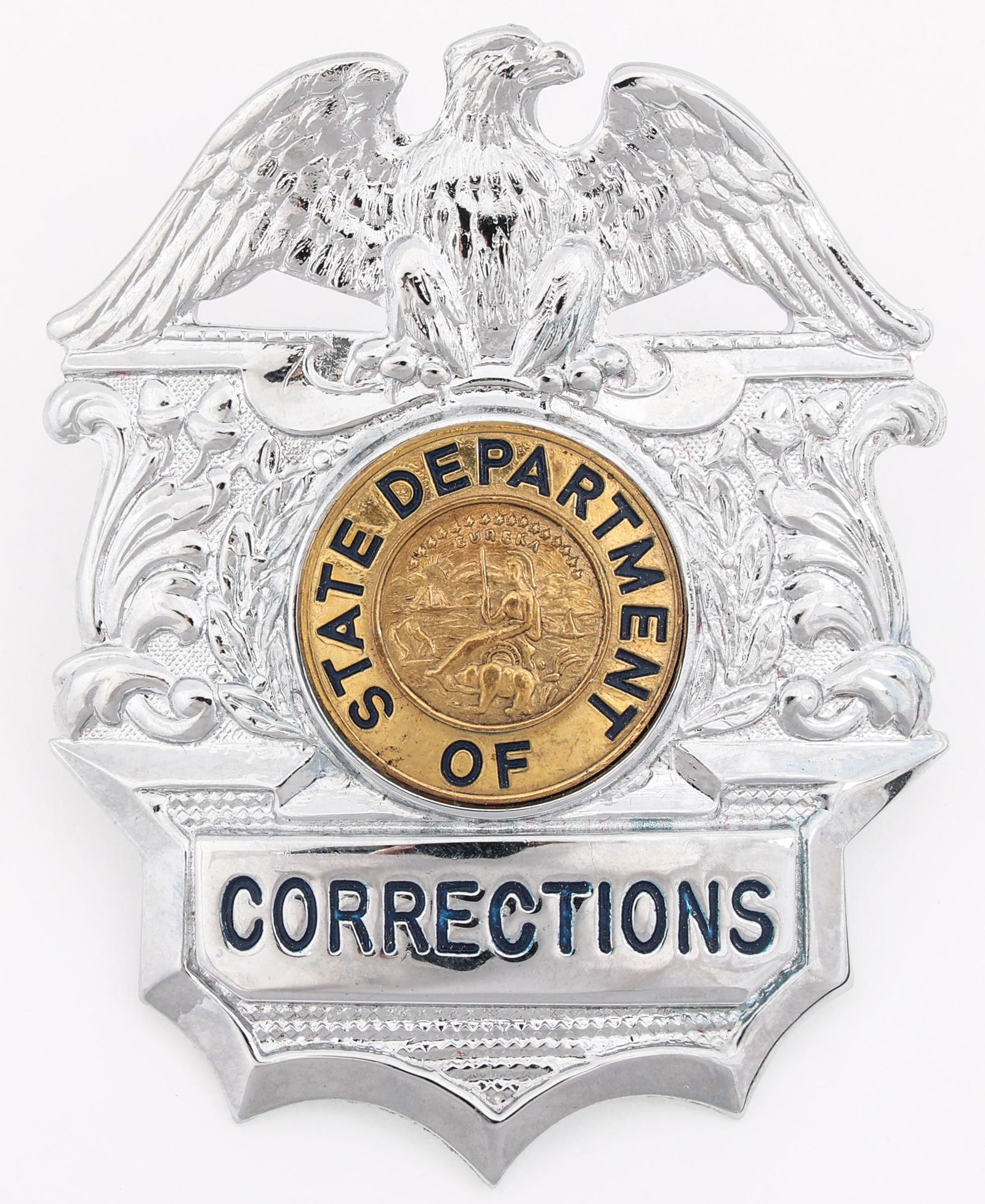 CALIFORNIA STATE DEPARTMENT OF CORRECTIONS BADGE: CALIFORNIA STATE DEPARTMENT OF CORRECTIONS BADGE Obsolete California State Department of Corrections badge. Marked THE ED JONES CO OAKLAND CA on reverse. Measurements: 2.5 X 2"