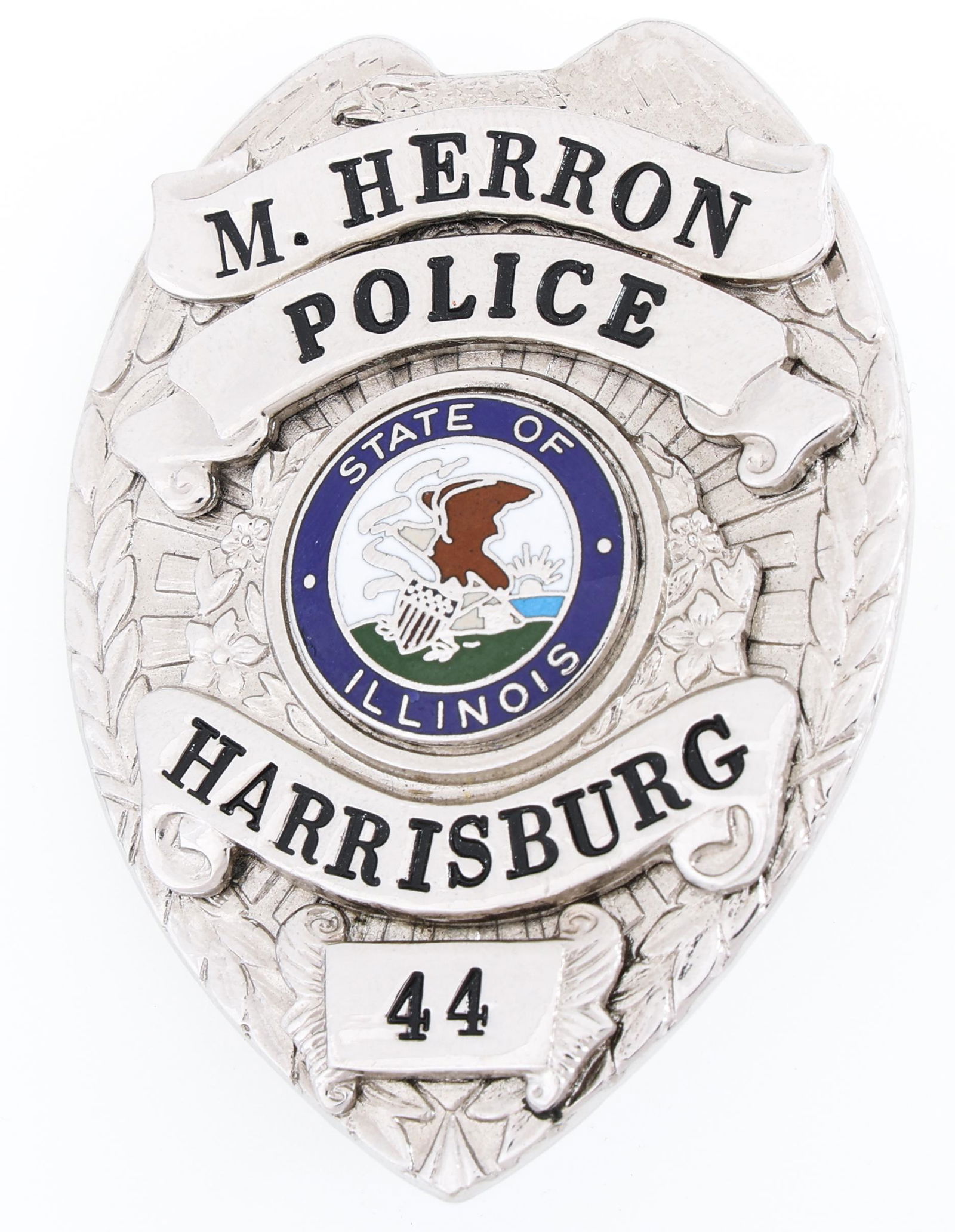 HARRISBURG ILLINOIS POLICE BADGE NO. 44 NAMED: HARRISBURG ILLINOIS POLICE BADGE NO. 44 NAMED Obsolete Harrisburg, Illinois Police badge. Named to M. Herron. Number 44. Unmarked. Measurements: 1.75 x 2.25"