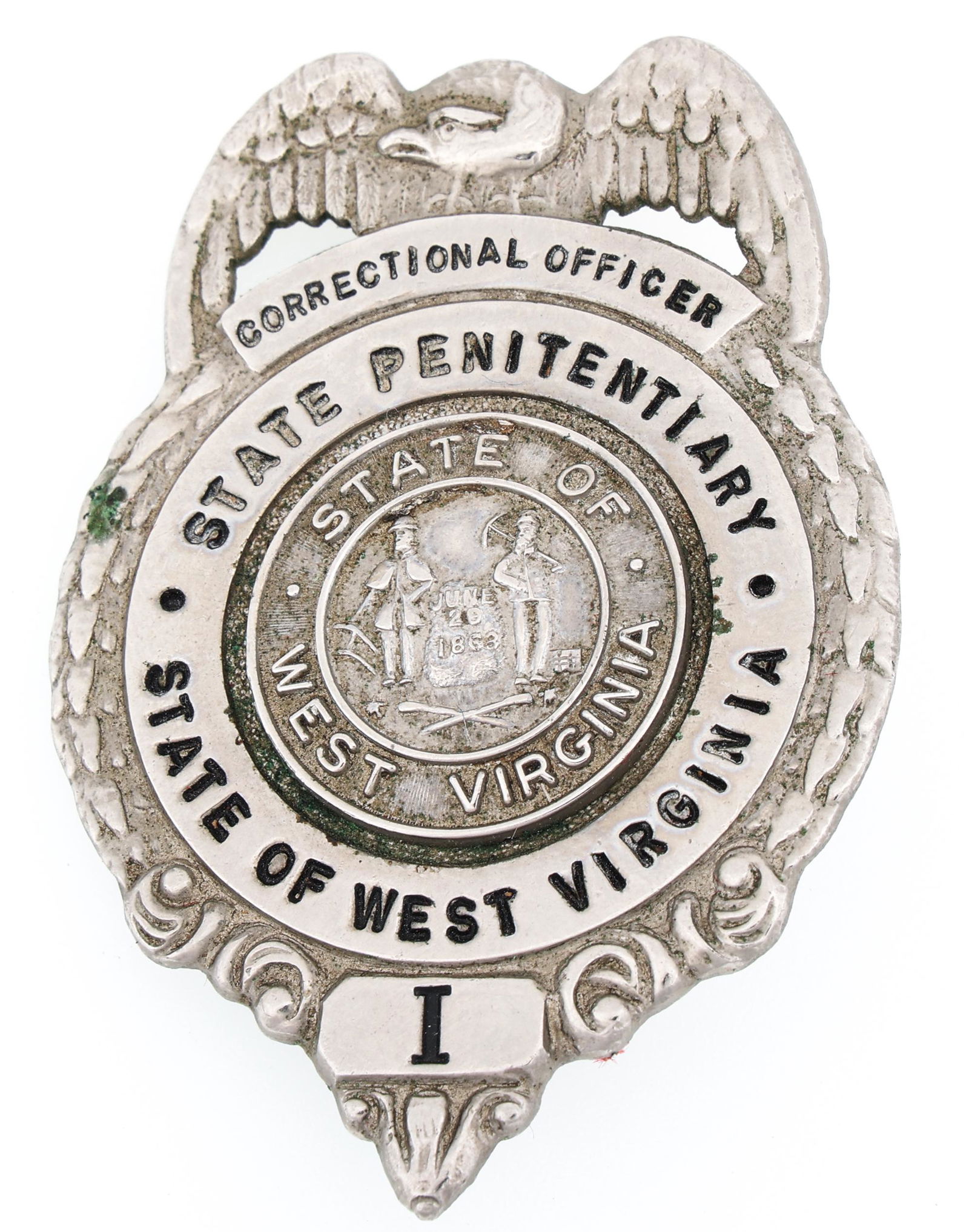 WEST VIRGINIA PENITENTIARY CORRECTIONAL OFFICER BADGE: WEST VIRGINIA PENITENTIARY CORRECTIONAL OFFICER BADGE Obsolete West Virginia State Penitentiary Correctional Officer badge. Front marked I. Back unmarked. Measurements: 1.75 x 2.5"