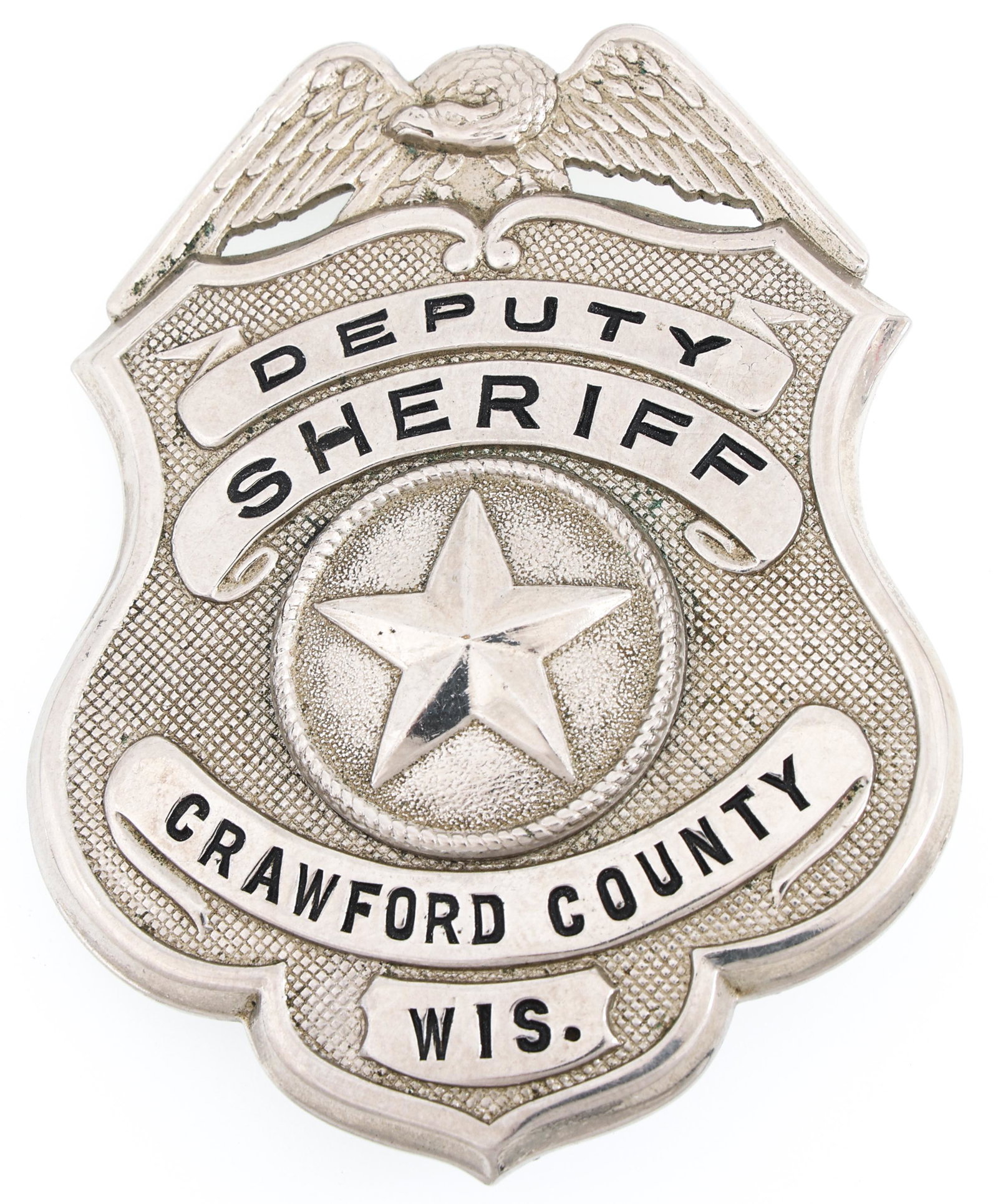 CRAWFORD COUNTY WISCONSIN DEPUTY SHERIFF BADGE: CRAWFORD COUNTY WISCONSIN DEPUTY SHERIFF BADGE Obsolete Crawford County Wisconsin Deputy Sheriff badge. Marked RUSSELL UNIFORM CO. NEW YORK on reverse. Measurements: 3 x 2.25"