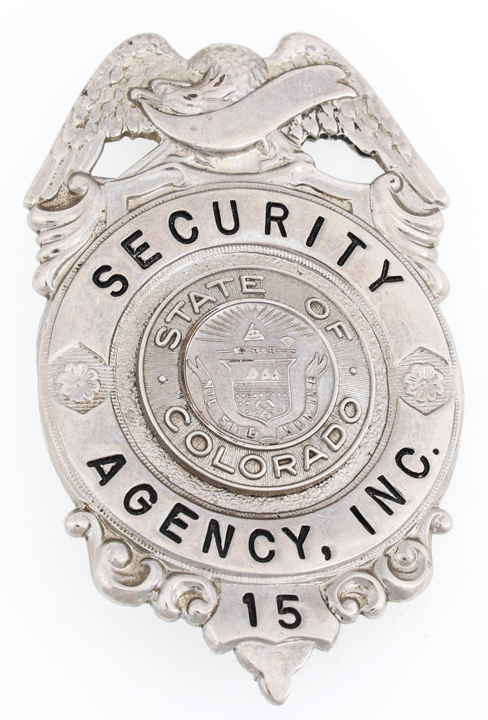 COLORADO SECURITY AGENCY, INC. BADGE NO. 15: COLORADO SECURITY AGENCY, INC. BADGE NO. 15 Obsolete Colorado Security Agency, Inc. badge. No. 15. Unmarked. Measurements: 2.5 x 2.75