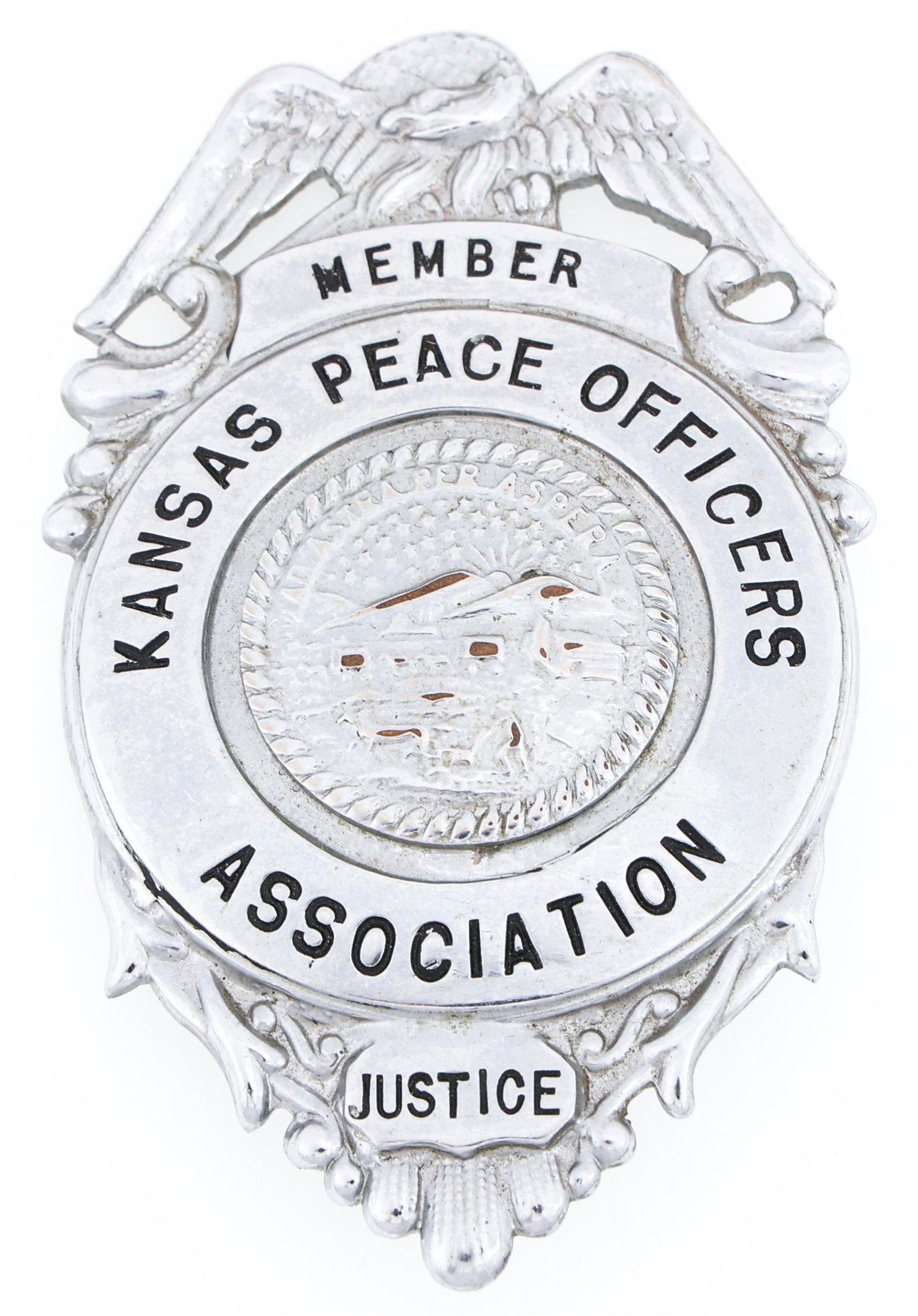 KANSAS PEACE OFFICERS ASSOCIATION MEMBER BADGE: KANSAS PEACE OFFICERS ASSOCIATION MEMBER BADGE Obsolete Kansas Peace Officers Association Member badge. Unmarked. Measurements: 1.75 x 3"