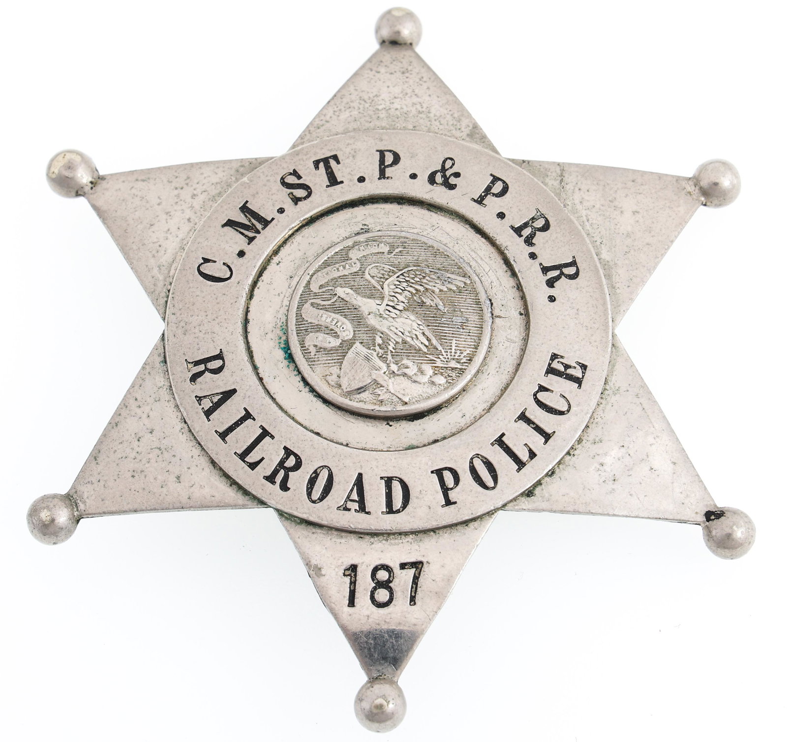 C.M. ST. P. & PACIFIC RAILROAD POLICE BADGE NO. 187: C.M. ST. P. & PACIFIC RAILROAD POLICE BADGE NO. 187 Obsolete Chicago, Milwaukee, St. Paul and Pacific Railroad (C.M. ST.P. & & P.R.R.) Police badge. Number 187. Marked Meyer & Wenthe 