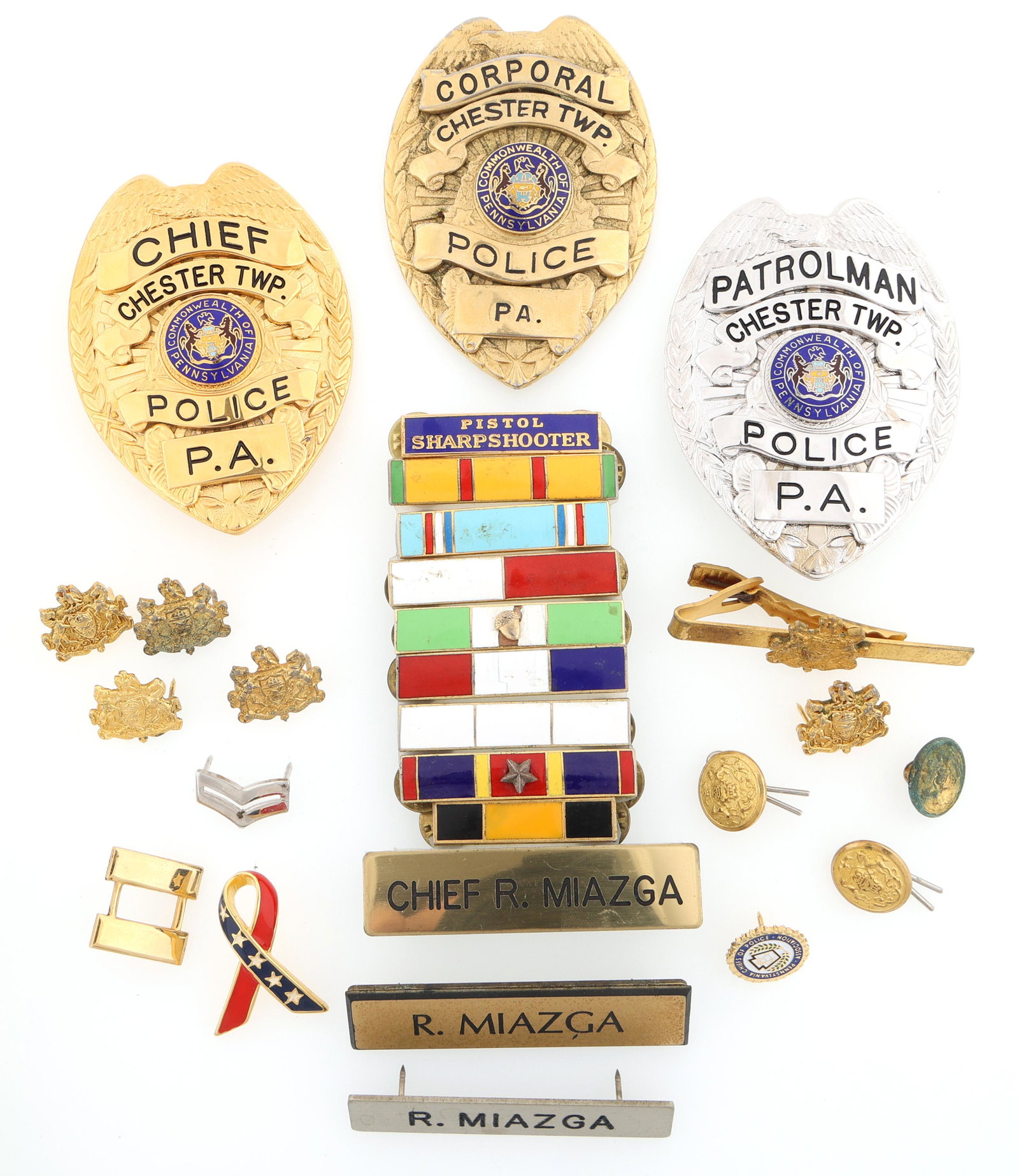 NAMED PENNSYLVANIA POLICE CAREER BADGES & PINS: NAMED PENNSYLVANIA POLICE CAREER BADGES & PINS Obsolete Chester Township, Pennsylvania police career badges and pins, includes: Patrolman badge, with matching name plate, "R. Miazga" Marked Smit