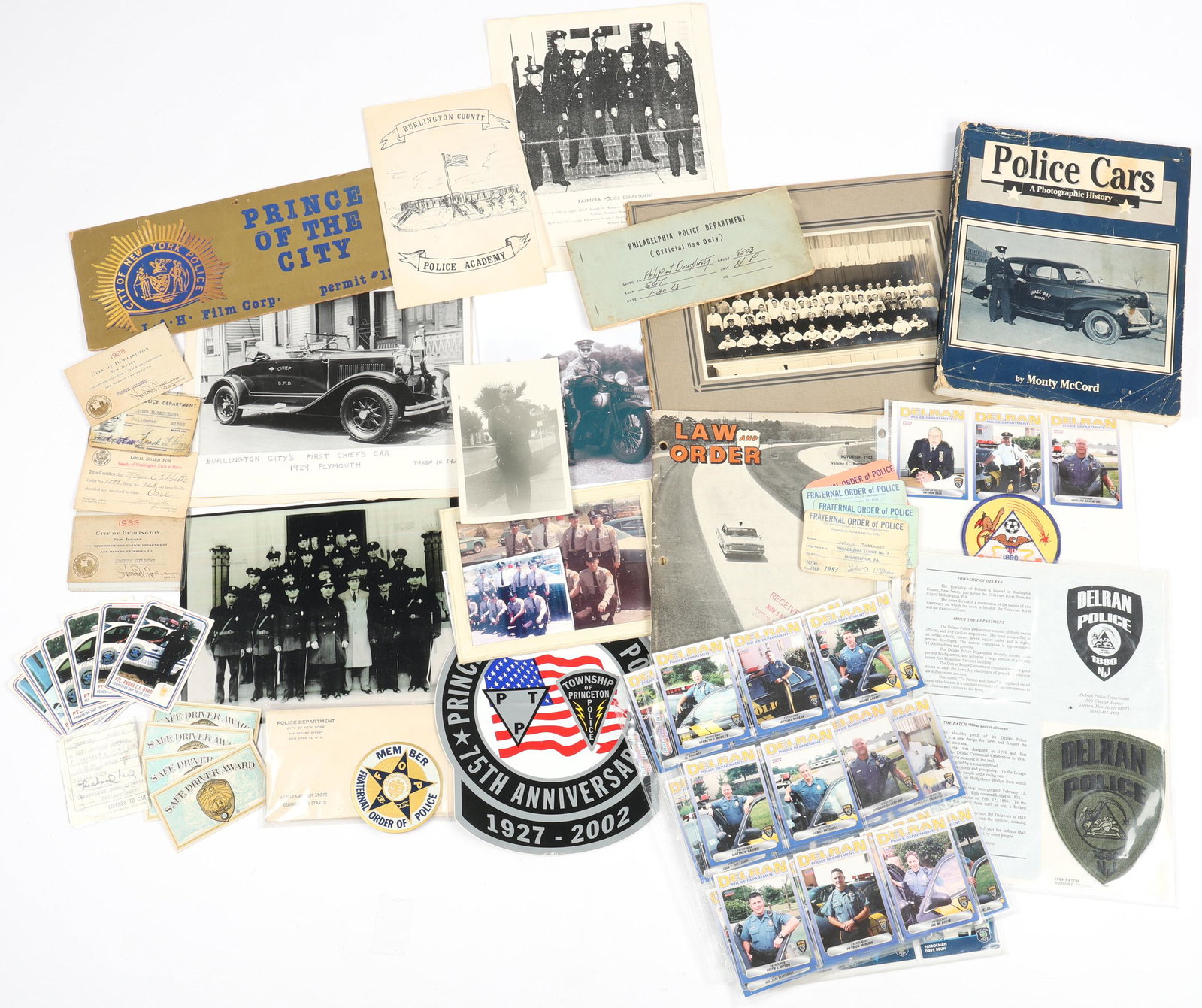 POLICE & LAW ENFORCEMENT BOOKS, MAGAZINE, EPHEMERA: POLICE & LAW ENFORCEMENT BOOKS, MAGAZINE, EPHEMERA Bonanza lot of mixed Police Department and Law Enforcement items. To include: Police Cars Photographic History book by Monty McCord Law & O