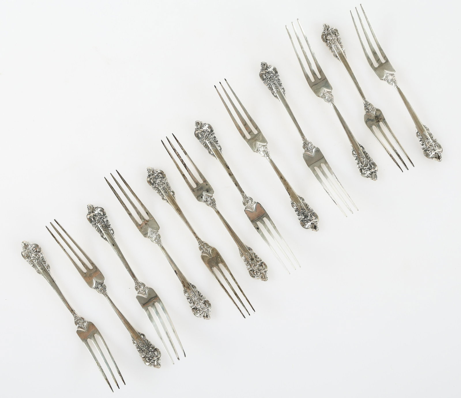 WALLACE STERLING SILVER GRANDE BAROQUE STRAWBERRY FORKS: WALLACE STERLING SILVER GRANDE BAROQUE STRAWBERRY FORKS Lot of twelve sterling silver Wallace Grande Baroque pattern strawberry forks. Size: 5" Weight: 171g
