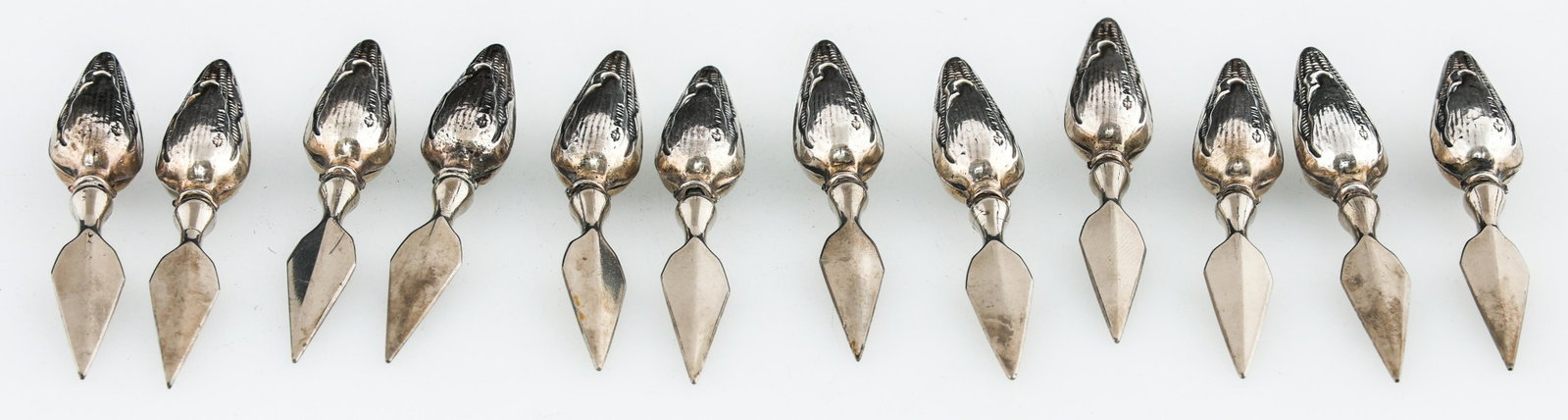WEBSTER COMPANY WEIGHTED STERLING SILVER CORN SPEARS: WEBSTER COMPANY WEIGHTED STERLING SILVER CORN SPEARS Lot of 12 weighted sterling silver corn holders, stainless steal spears. Marked Webster Company. Size: 3" Weight: 113.2g