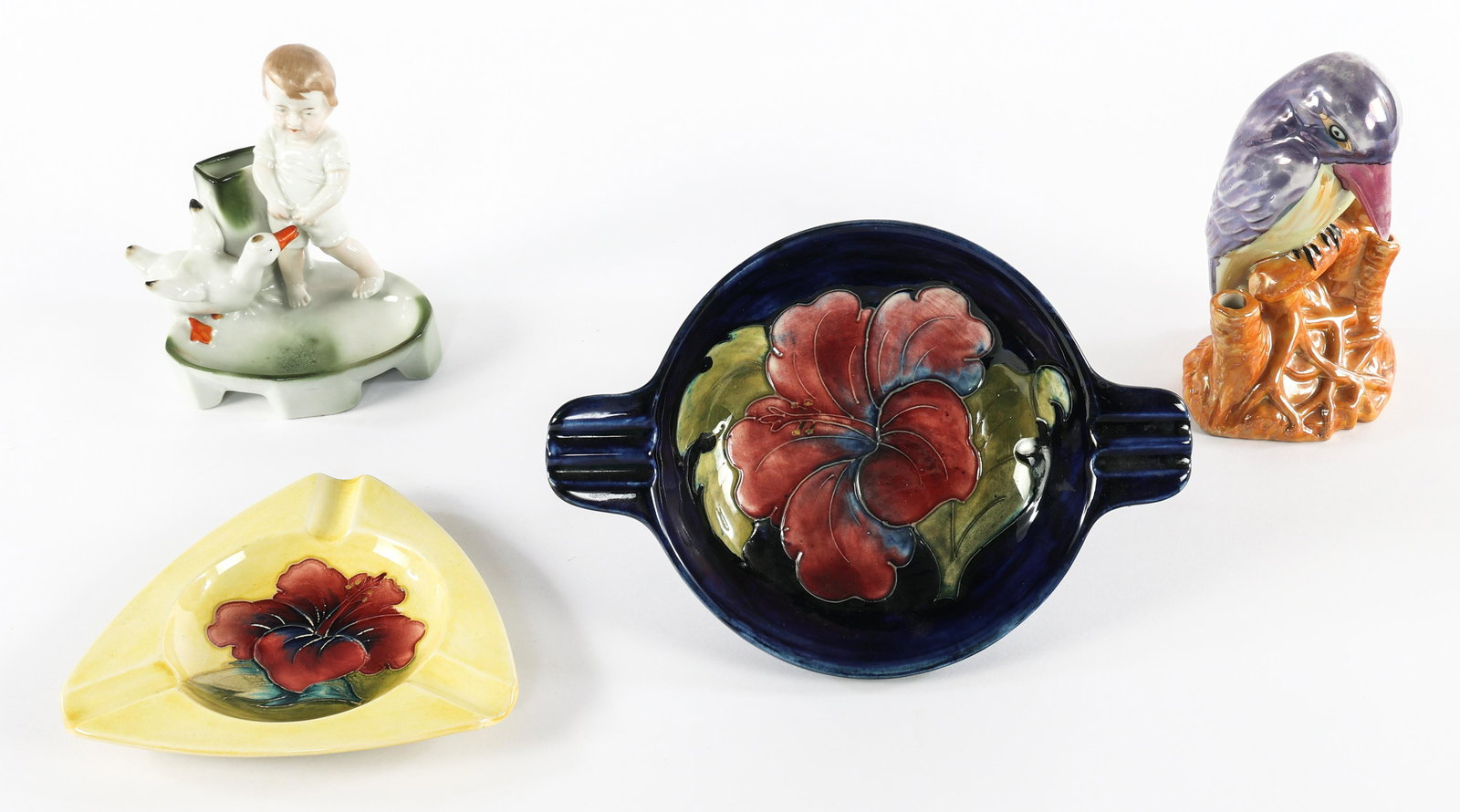 CERAMIC ASHTRAY AND FIGURINES - LOT OF FOUR: CERAMIC ASHTRAY AND FIGURINES - LOT OF FOUR Lot of four ceramics lot, includes: Bird figurine. Marked Nippon on underside. 6.5"5" Boy and duck figurine. Unmarked. Blue floral ashtray. 8.