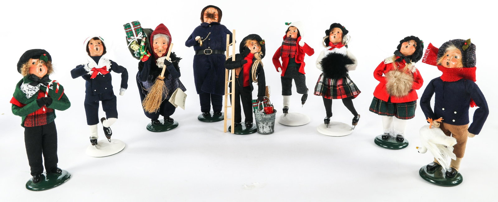BYERS' CHOICE CAROLERS - LOT OF NINE: BYERS' CHOICE CAROLERS - LOT OF NINE Lot of nine Byer's Choice Christmas themed carolers, includes: (5) 1994 The Carolers (3) 1994 The Skaters 1992 The Carolers Size: 10", 13"