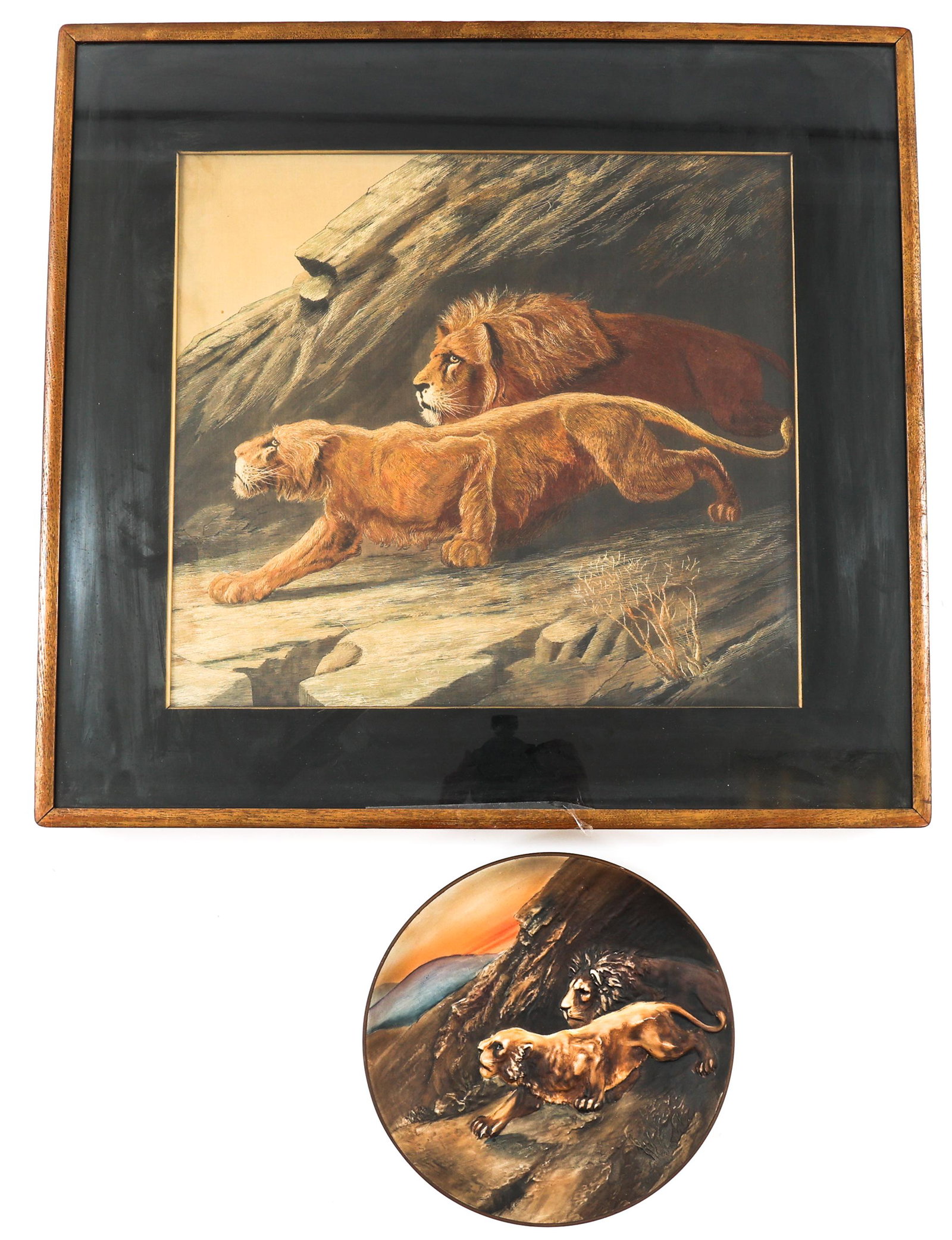 CROUCHING LIONS SILK EMBROIDERY, PORCELAIN NIPPON PLATE: CROUCHING LIONS SILK EMBROIDERY, PORCELAIN NIPPON PLATE Crouching lion silk embroidery in wood frame, and porcelain Nippon hand painted, high relief plate. Plate is marked on reverse. 