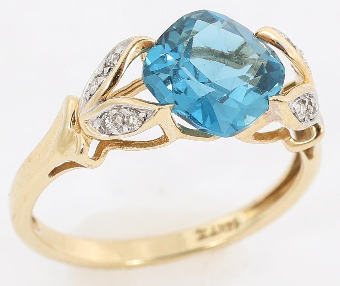 14K YELLOW GOLD LONDON BLUE TOPAZ FASHION RING: 14K YELLOW GOLD LONDON BLUE TOPAZ FASHION RING 14K yellow god London blue topaz fashion ring: One 8 x 8mm cushion cut London blue topaz Six 0.8mm round white diamonds Size: 7 Weight: 2.7g