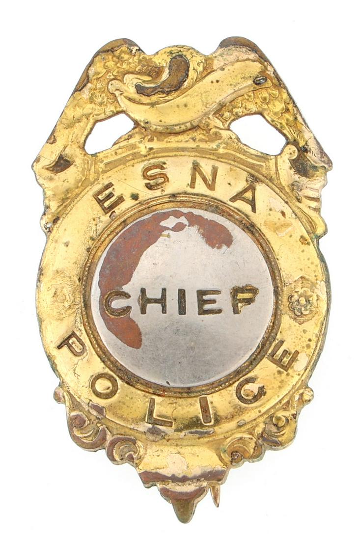 E SNA POLICE CHIEF BADGE: E SNA POLICE CHIEF BADGE Obsolete E. SNA Police Chief badge. Unmarked. Measurements: 1 x 1.5"
