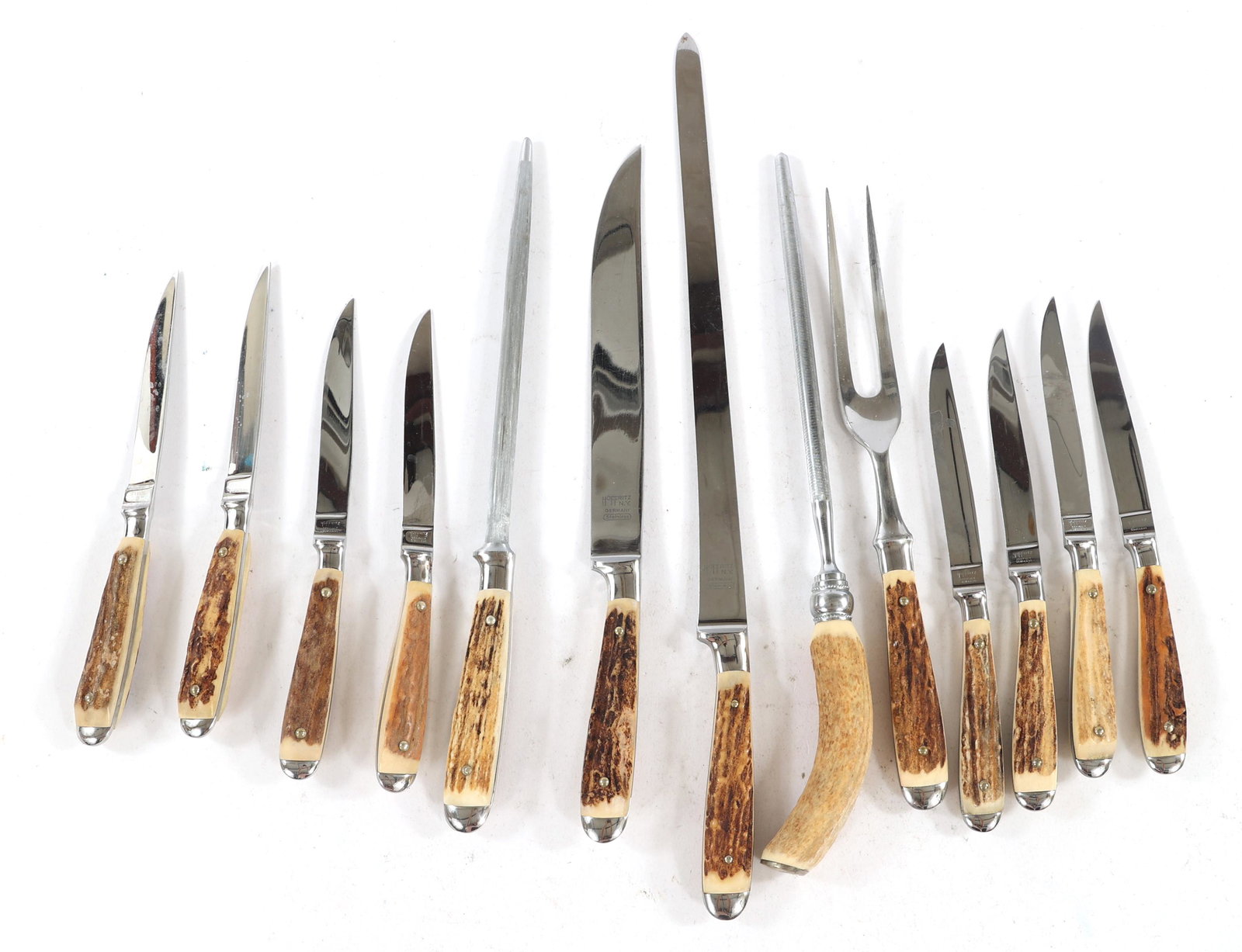 STAG HANDLE GERMAN KITCHEN KNIVES AND UTENSILS: STAG HANDLE GERMAN KITCHEN KNIVES AND UTENSILS Stag handle German steel kitchen knives and utensils, includes: Unmarked sharpening steel. 13.25" Unmarked sharpening steel. 13.5" Hoffritz carv