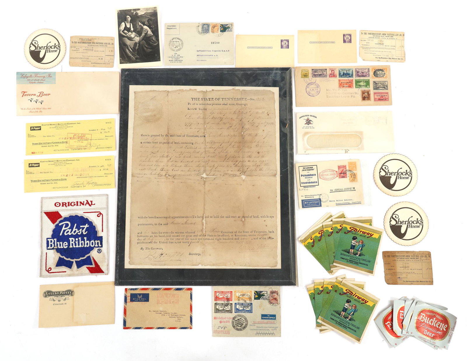 AMERICAN PAPER EPHEMERA: AMERICAN PAPER EPHEMERA American paper ephemera, includes: Endorsed company checks. Paper coaster. Manufacturer labels. Cancelled postage stamps and envelopes 1809 Tennessee framed land grant. 16 x