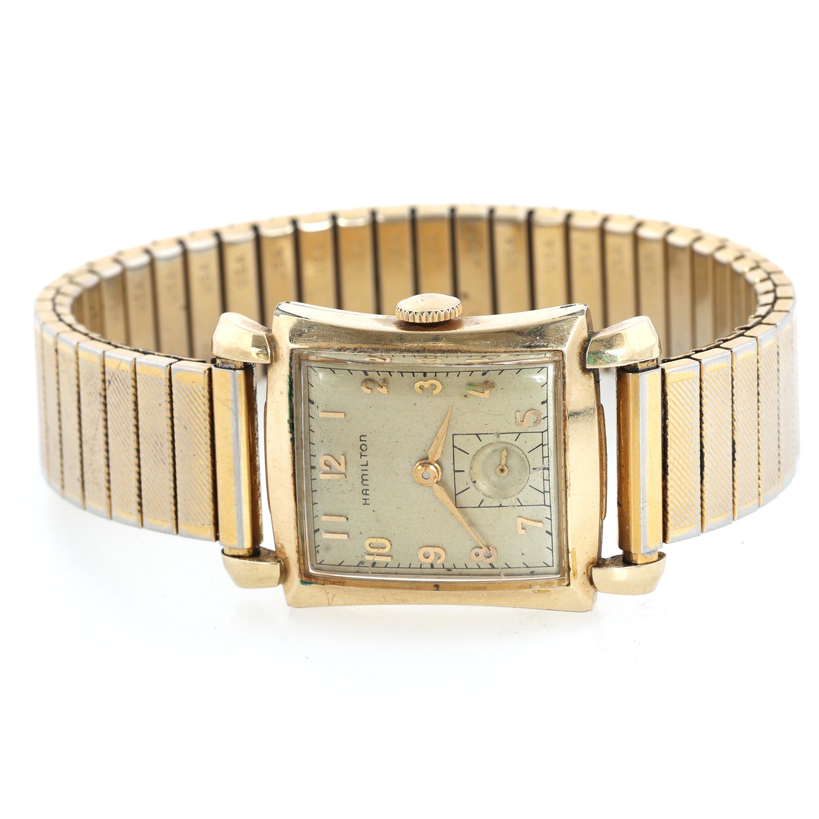 MEN'S HAMILTON GOLD FILLED CASE WRIST WATCH: MEN'S HAMILTON GOLD FILLED CASE WRIST WATCH Men's Hamilton gold filled case wrist watch: Arabic numerals Case #: L787921 22 jewels 770 movement Size: 24mm Weigh