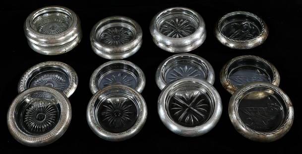 WEIGHTED STERLING SILVER COASTERS - LOT OF 16: WEIGHTED STERLING SILVER COASTERS - LOT OF 16 Lot of 16 weighted sterling silver coasters with glass bottoms, incldues: (2) Coasters with floral glass design. Marked "STC". 4" diameter Crown Sterli