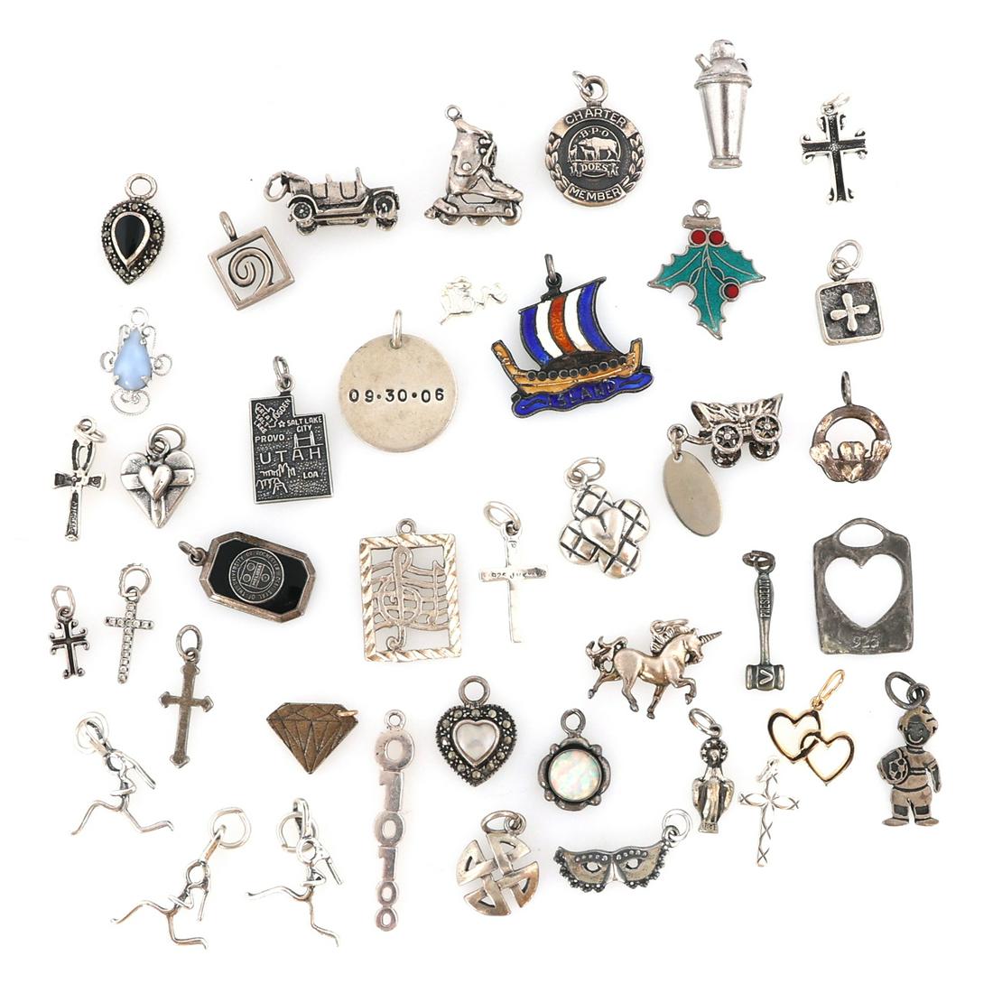 STERLING SILVER CHARMS: STERLING SILVER CHARMS Mixed lot of sterling silver charms, all pieces are marked or tested. Weight: 68.8 grams total
