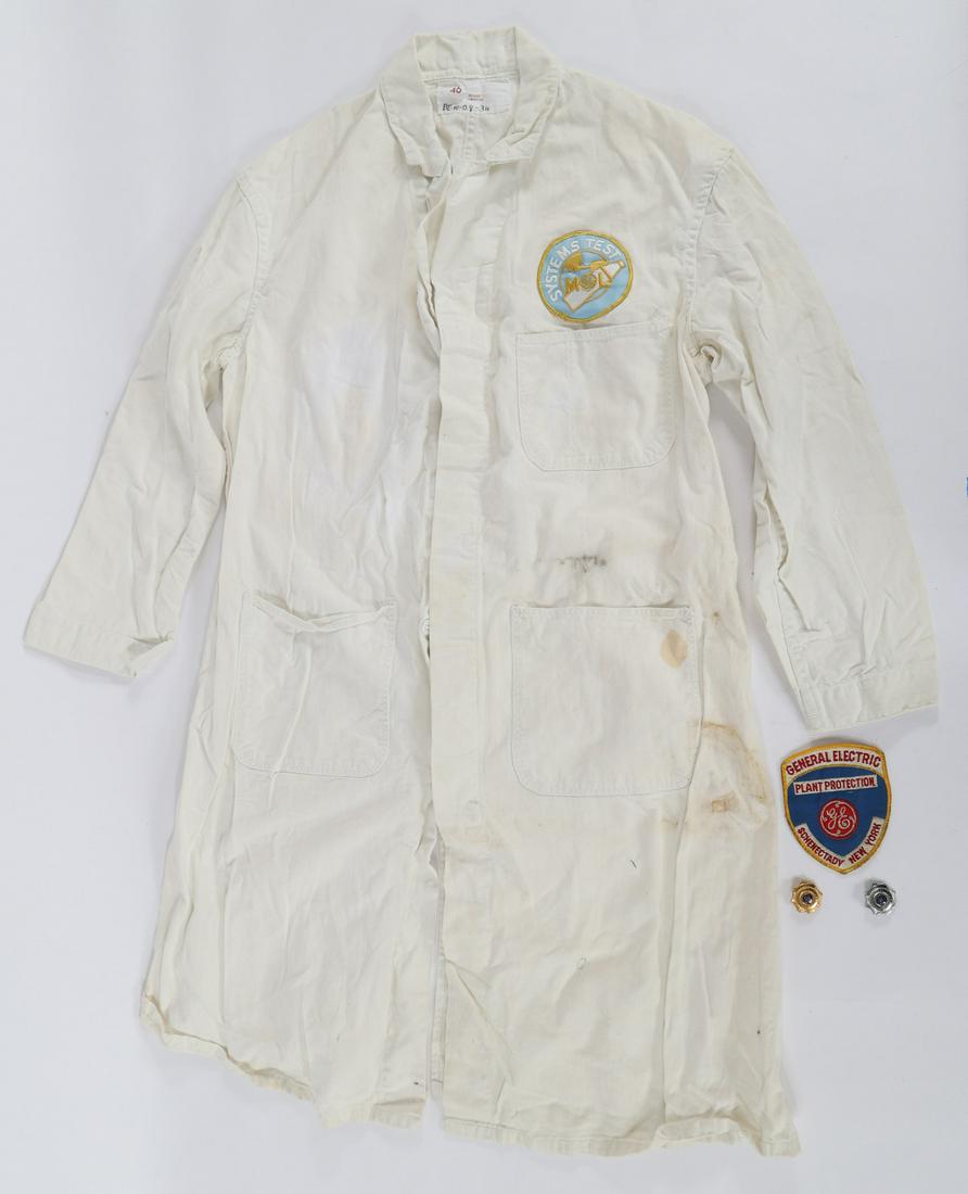 GENERAL ELECTRIC SHIRT AND ACCESSORIES: GENERAL ELECTRIC SHIRT AND ACCESSORIES Obsolete General Electric partial uniform and accessories, including: Button-down overcoat with Systems Test badge. 22" shoulder to shoulder, 47.5" length