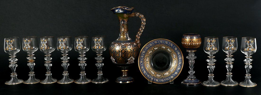 ART NOUVEAU GLASSES CLARET SAUCER FRITZ HECKERT & MORE: ART NOUVEAU GLASSES CLARET SAUCER FRITZ HECKERT & MORE Art Nouveau glass serve ware, includes: Matching enamel painted Jodhpur set by Fritz Heckert, ca. 1900's: Claret jug with saucer - 11.75"