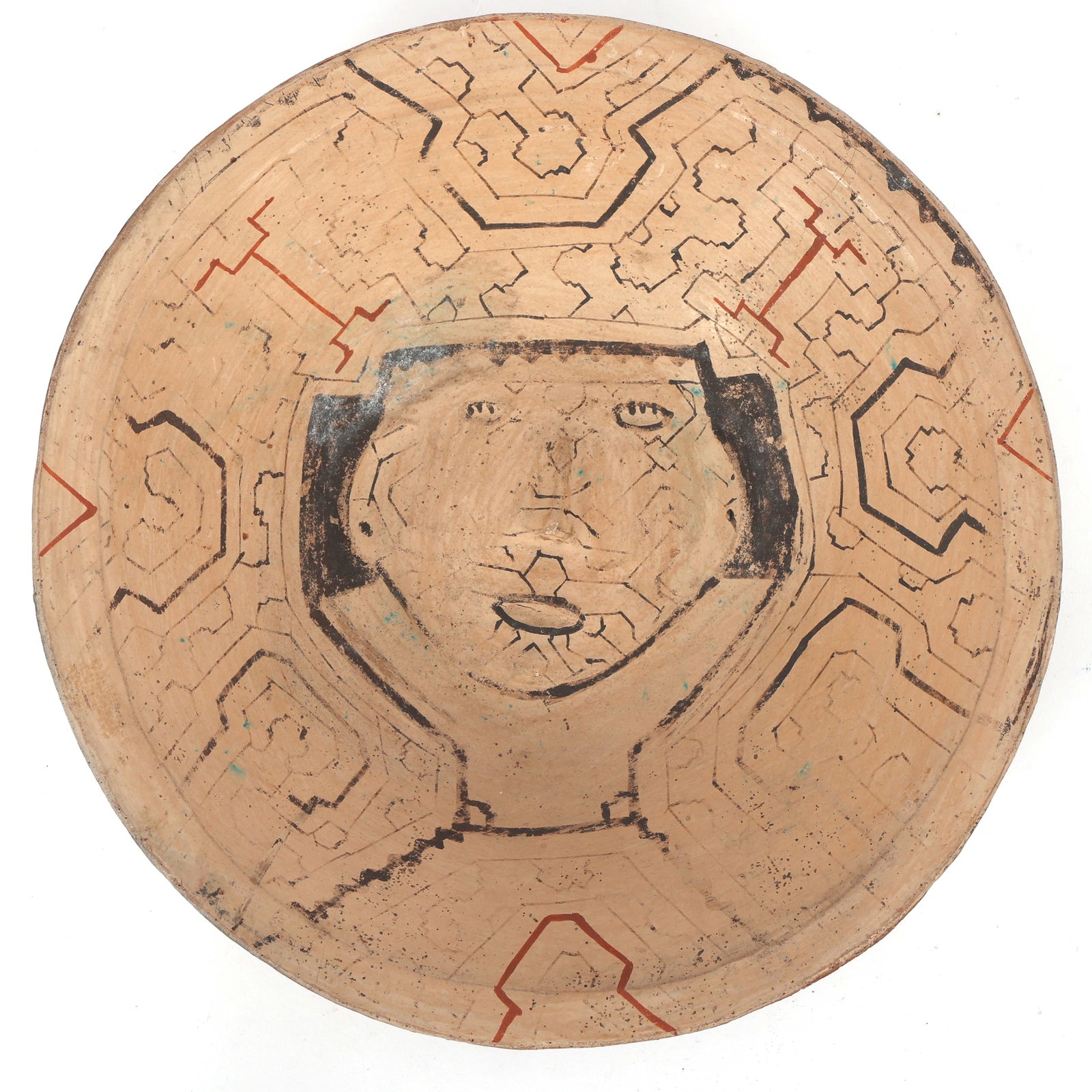 PERUVIAN SHIPIBO POTTERY BOWL: PERUVIAN SHIPIBO POTTERY BOWL Peruvian Shipibo pottery bowl with traditional geometric lineaments and anthropomorphic face in the center. Size: 12.5 x 3"