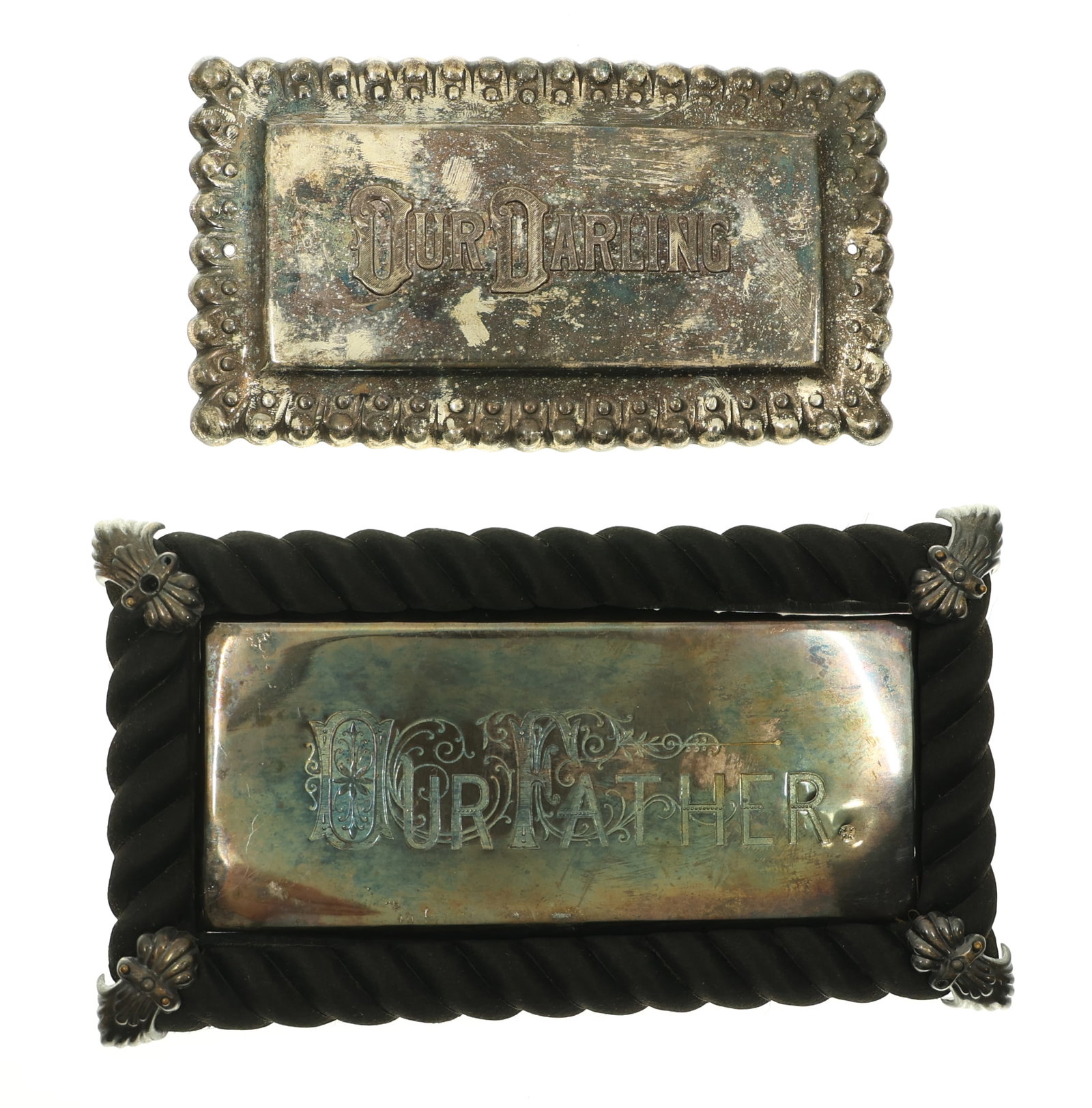 OUR DARLING & OUR FATHER CASKET PLATES: OUR DARLING & OUR FATHER CASKET PLATES Two casket plates that read "Our Darling" and "Our Father". Includes a fitted black silk frame. Size: Largest; 7 x 4"