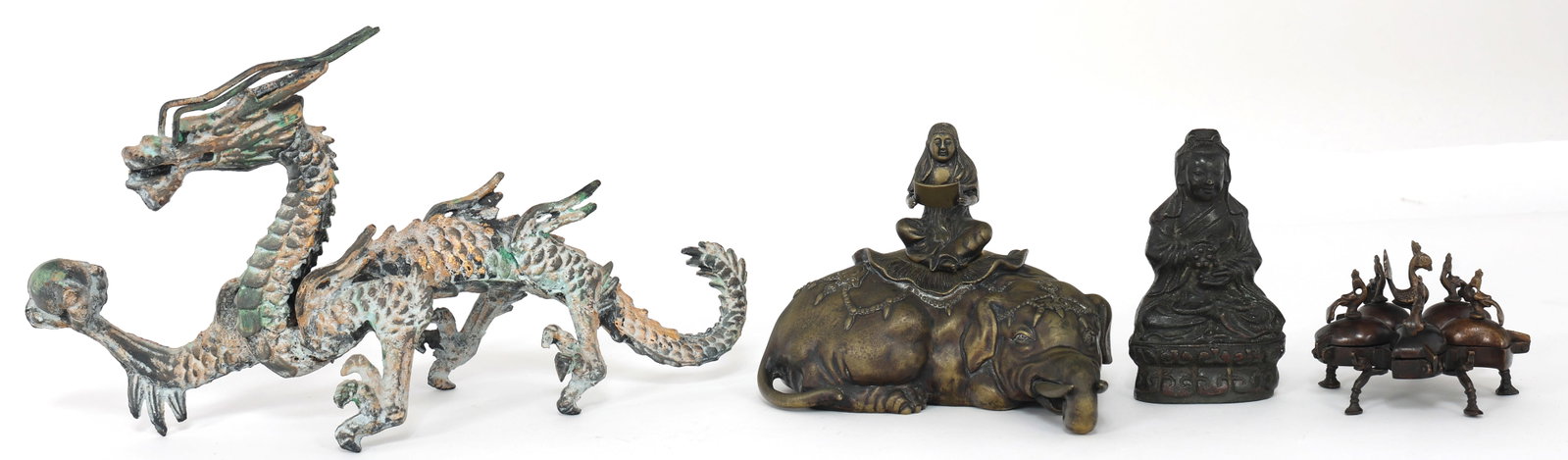 ASIAN METAL SCULPTURES AND CONTAINERS: ASIAN METAL SCULPTURES AND CONTAINERS Asian sculptures and containers, includes: Dragon sculpture, 14.25 x 8" Fiigurla sculpture, 5.5 x 3" Peacock spice/pigment container, 4 x 3.25" Buddha jar, 7.25 x