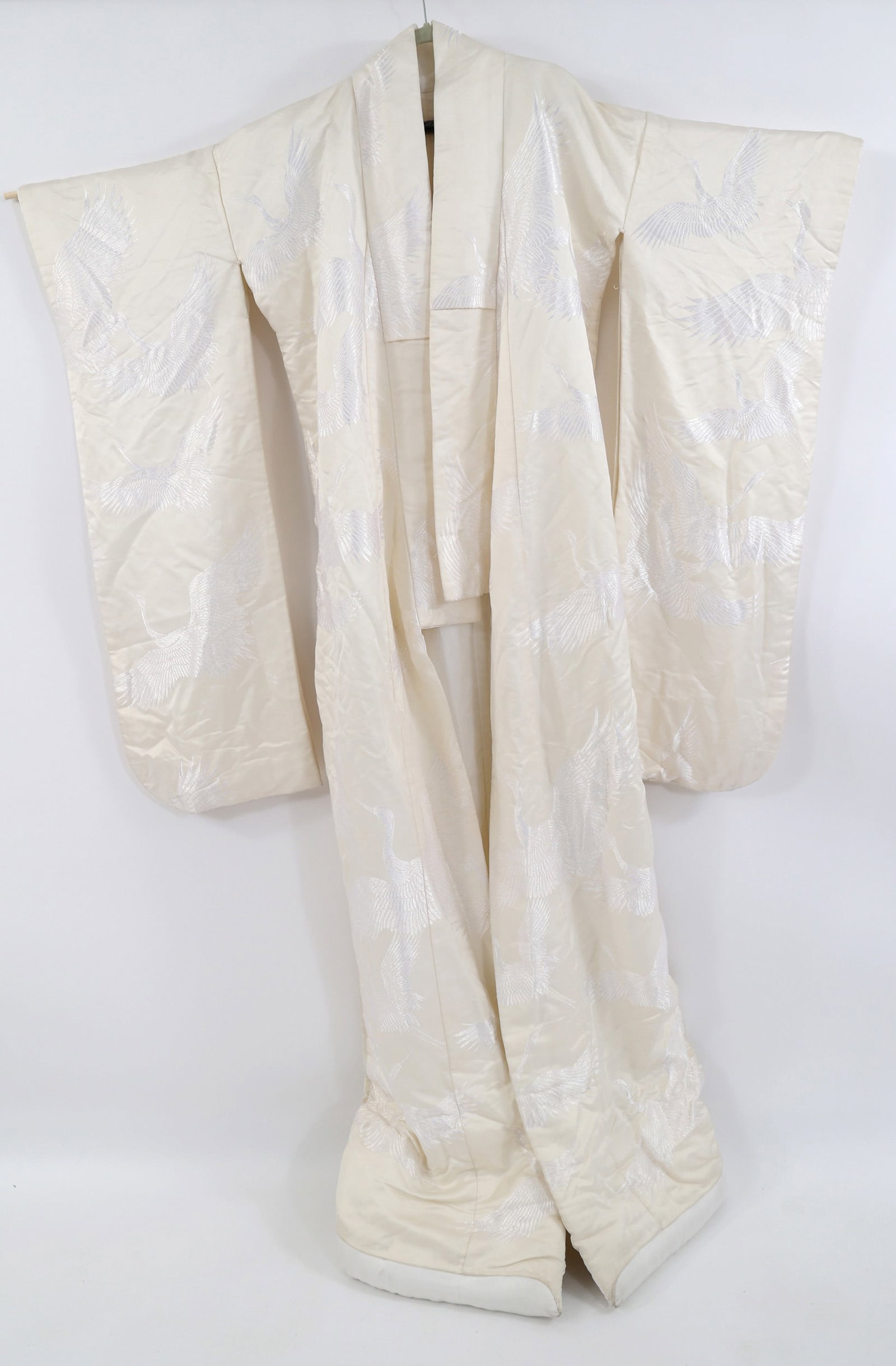 JAPANESE BROCADE WEDDING KIMONO: JAPANESE BROCADE WEDDING KIMONO Japanese white satin brocade wedding kimono with crane design, no tags. Wrist to wrist: 54" Sleeve length: 41" Nape to hem: 74"
