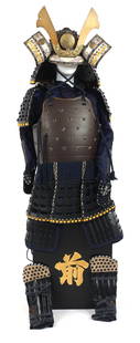 JAPANESE SAMURAI SUIT OF ARMOR: JAPANESE SAMURAI SUIT OF ARMOR Japanese Samurai suit of armor, contemporary. Black tile armor against a royal blue brocade fabric with floral design. Complete with helmet, chest armor, armored skirt,