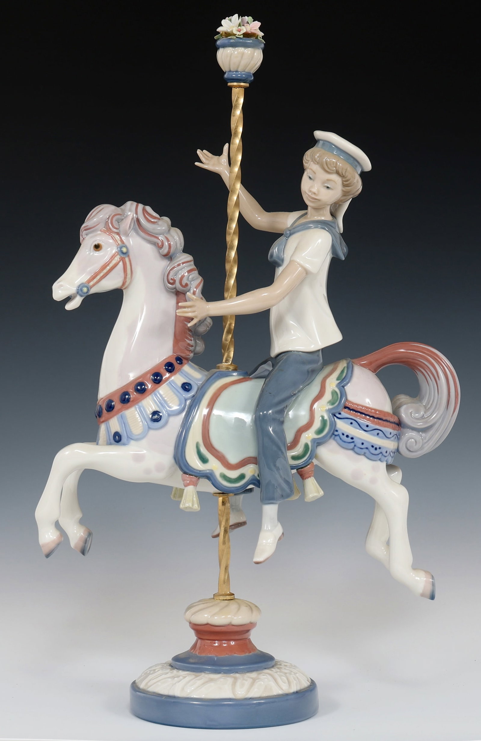 LLADRO PORCELAIN 1470 BOY ON CAROUSEL FIGURINE: LLADRO PORCELAIN 1470 BOY ON CAROUSEL FIGURINE Lladro porcelain Boy on Carousel Horse 1470 figurine. Size: 15.25 x 9.5"