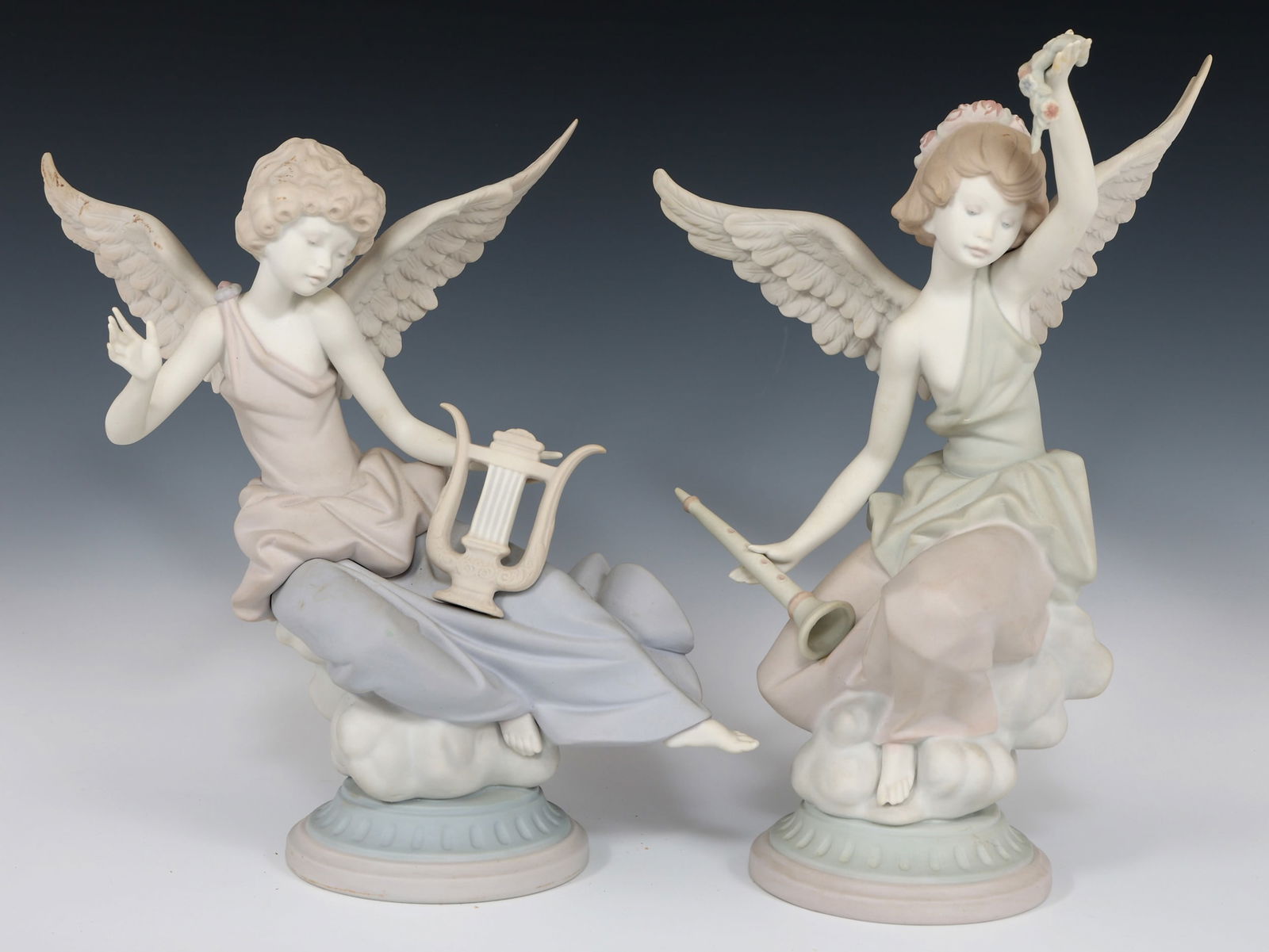 LLADRO PORCELAIN CAREFREE ANGEL 1463 &1464 FIGURINES: LLADRO PORCELAIN CAREFREE ANGEL 1463 &1464 FIGURINES Lladro porcelain Carefree Angle figurines. Includes: Angel with Lyre 1464 figurine 9.5 x 11" Angel with flute 1963 figurine 11 x 7.5