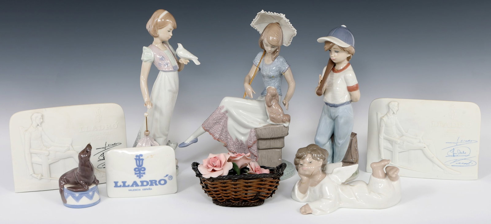LLADRO PORCELAIN FIGURINES & PLAQUES: LLADRO PORCELAIN FIGURINES & PLAQUES Lladro porcelain figurines and plaques, including: "Angel Laying Down" #4541 "Summer Stroll" #7611 "Picture Perfect" #7612