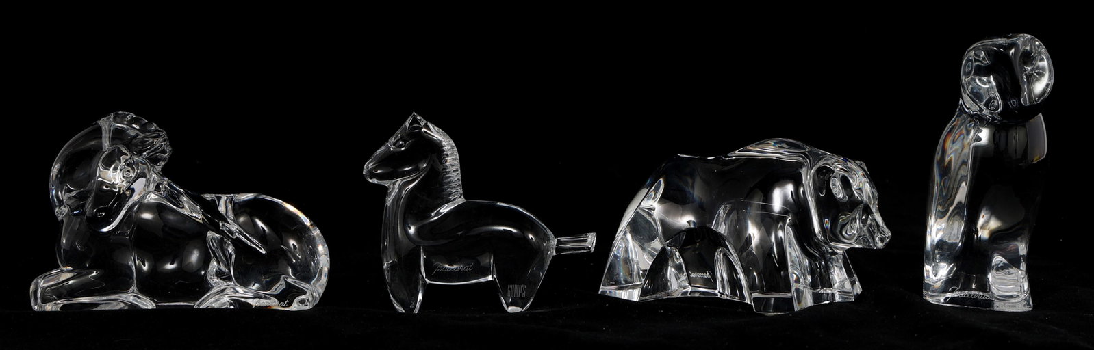 BACCARAT CRYSTAL ANIMAL & MYTHICAL FIGURINES: BACCARAT CRYSTAL ANIMAL & MYTHICAL FIGURINES Four Baccarat crystal figurines, each piece marked on the underside and along the bottom edge, including: Owl, 4.25" Bear, 4.5 x 2.5"<