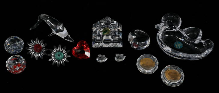 SWAROVSKI, WATERFORD CRYSTAL FIGURINES & PAPERWEIGHTS: SWAROVSKI, WATERFORD CRYSTAL FIGURINES & PAPERWEIGHTS Crystal figurines and paperweights, including: Swarovski solid crystal paperweights and coin-embedded paperweights Swarovski