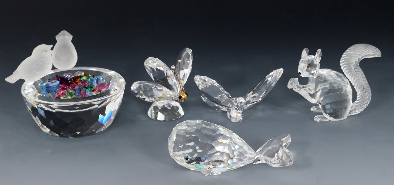 SWAROVSKI CRYSTAL ANIMAL FIGURINES: SWAROVSKI CRYSTAL ANIMAL FIGURINES Five Swarovski Crystal animal figurines. All in boxes. Includes: Squirrel figurine with base Squirrel 2.5 x 2.75" Base 3 x 3"</