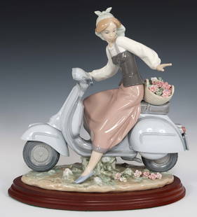 LLADRO GIRL ON VESPA PORCELAIN FIGURINE 5143: LLADRO GIRL ON VESPA PORCELAIN FIGURINE 5143 Lladro&nbsp;porcelain 5143 Girl on Vespa figurine with wooden base.&nbsp; Size: 11 x 10.5"