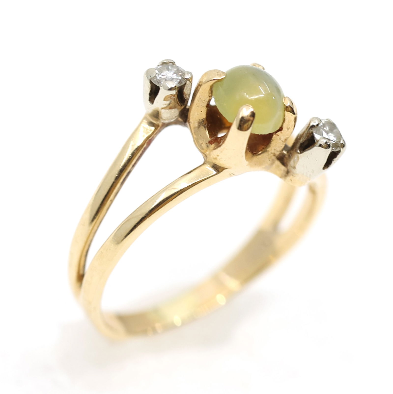 10K YELLOW GOLD CHRYSOBERYL & DIAMOND BABY RING: 10K YELLOW GOLD CHRYSOBERYL & DIAMOND BABY RING 10K yellow gold chrysoberyl and diamond baby ring: (1) 4.25mm round cabochon banded chrysoberyl (2) 0.03 ct round white diamonds Size: 2