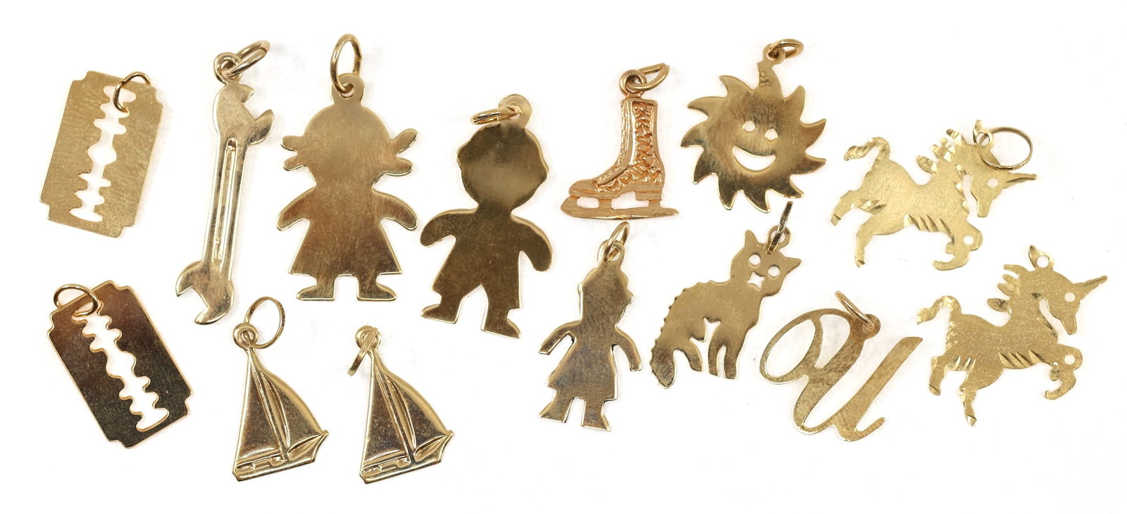 14K YELLOW GOLD CHARMS: 14K YELLOW GOLD CHARMS 14K yellow gold charms: Unicorns Sailboats Skates Sun Figural Weight: 7g
