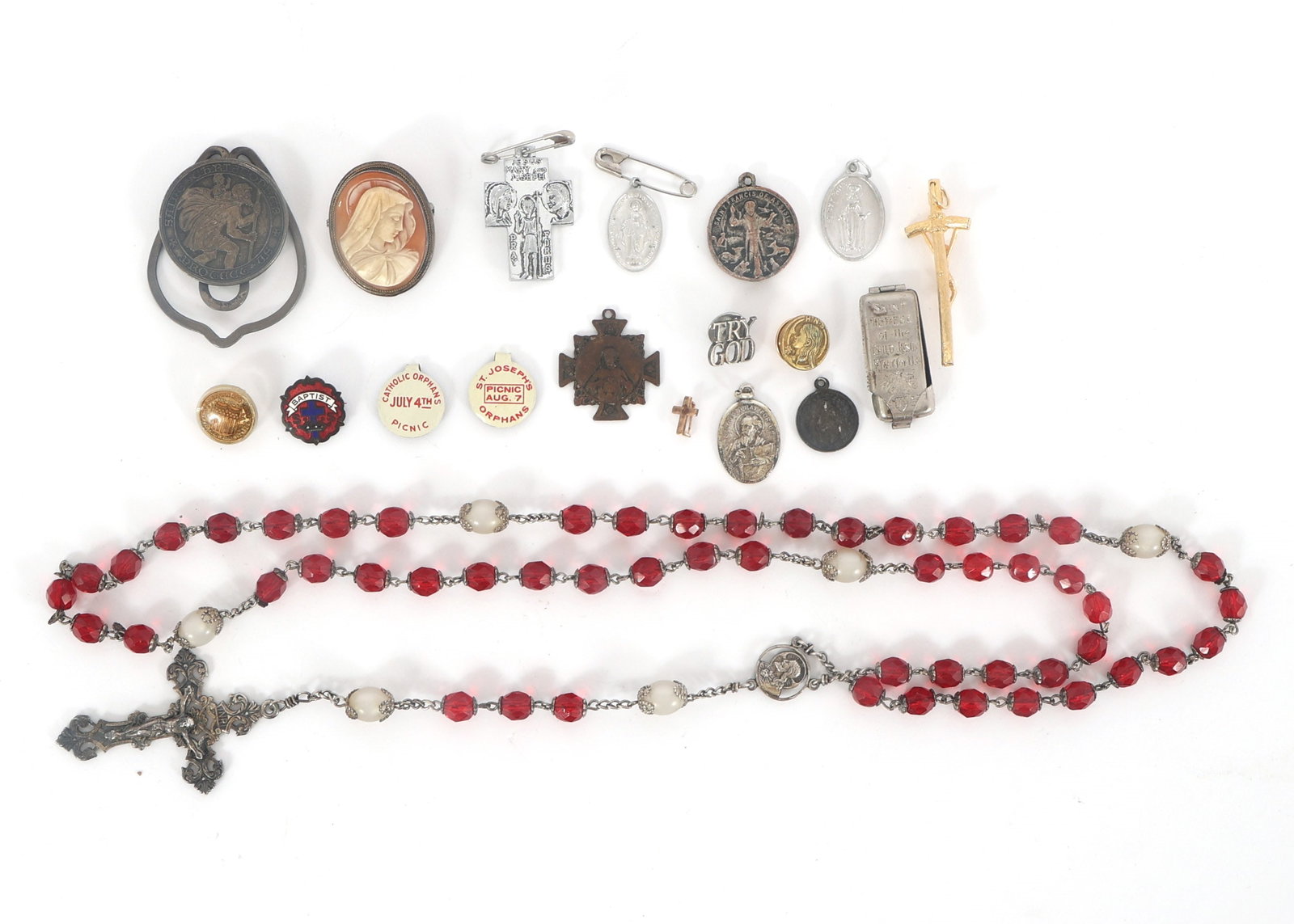 RELIGIOUS PINS, TOKENS, AND STERLING SILVER ROSARY: RELIGIOUS PINS, TOKENS, AND STERLING SILVER ROSARY (19) Religious Pins, tokens, and sterling silver rosary. Red glass beaded rosary with faux pearl accents, sterling silver chain, 24" Virgin Mary came