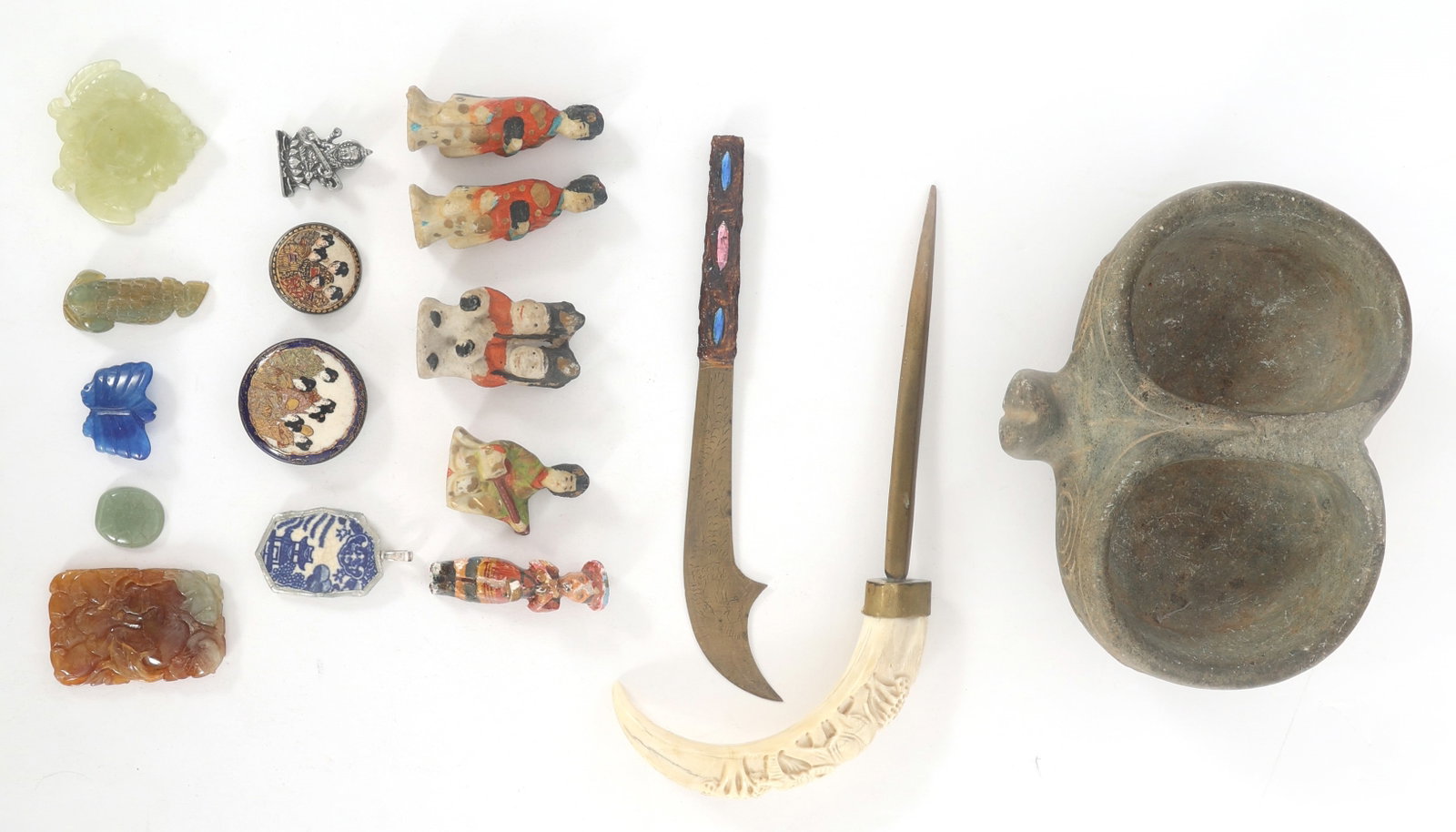 ASIAN FIGURINES & CARVINGS: ASIAN FIGURINES & CARVINGS Asian decorative figurines & carvings include: Stone vessel with 2 sections 6.5" x 5" x 2.5" Letter opener with carved boar tusk handle 8" Letter opener with eng