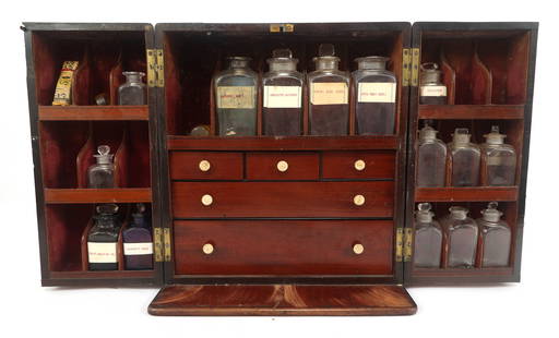 ENGLISH MAHOGANY TRAVELING APOTHECARY CABINET: ENGLISH MAHOGANY TRAVELING APOTHECARY CABINET English mahogany traveling apothecary cabinet. Includes glass bottles, vessels, and tools. Includes label from The British Antique Dealers Assoc