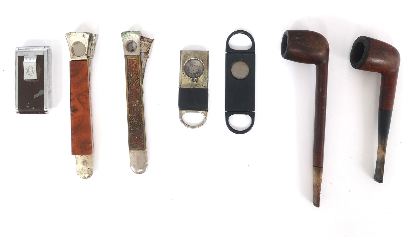 SMOKING PIPES, CIGAR CUTTERS, & CIGAR LIGHTER: SMOKING PIPES, CIGAR CUTTERS, & CIGAR LIGHTER Tobacciana accessories: (2) Pipes 2 x 6" 1.75 x 7" (4) Cigar cutters (2) 5.75" 