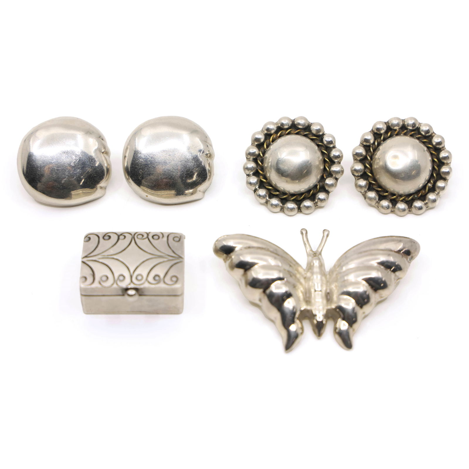 STERLING SILVER TAXCO EARRINGS, BROOCH, & PILL BOX: STERLING SILVER TAXCO EARRINGS, BROOCH, & PILL BOX Sterling silver Taxco jewelry includes: Two-tone earrings Sheila "Laton" artist mark TO-45