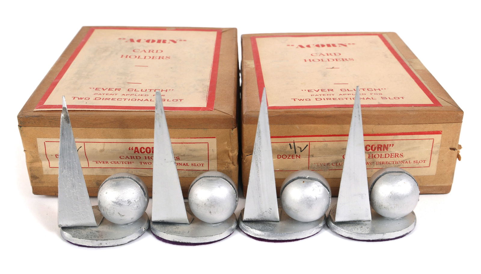 NEW YORK WORLD'S FAIR 1939 NAME CARD HOLDERS: NEW YORK WORLD'S FAIR 1939 NAME CARD HOLDERS 1939 New York World's Fair Trylon & Perisphere "Acorn" name card holders, with original boxes (12) Size: 1.75" x 1.25" x 3"